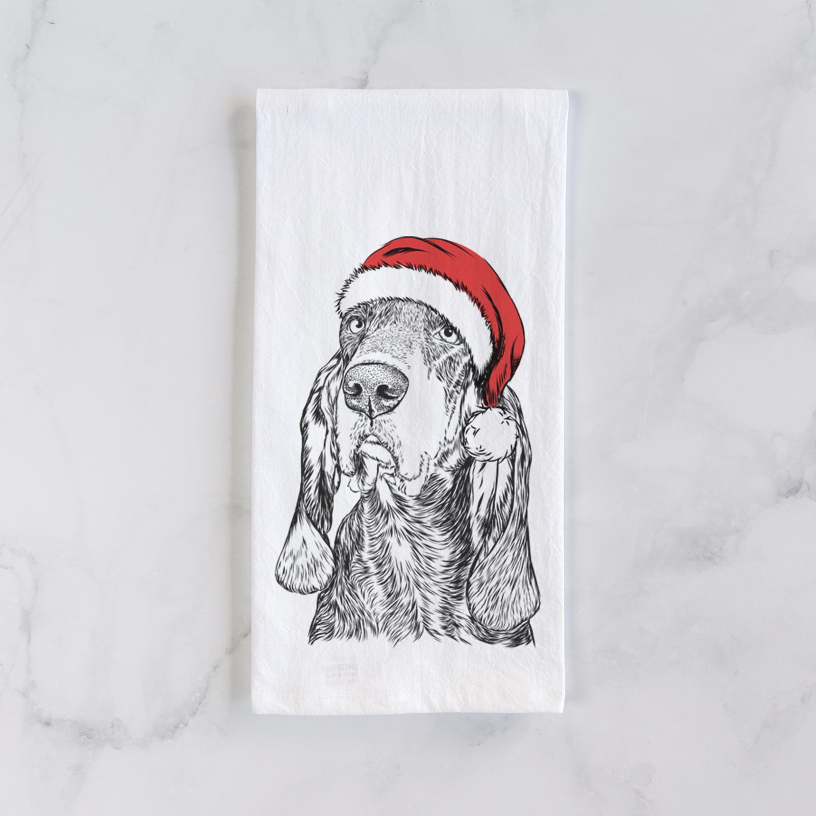 Hand-drawn sketch of Stu the Black and Tan Coonhound wearing a Santa hat on a tea towel