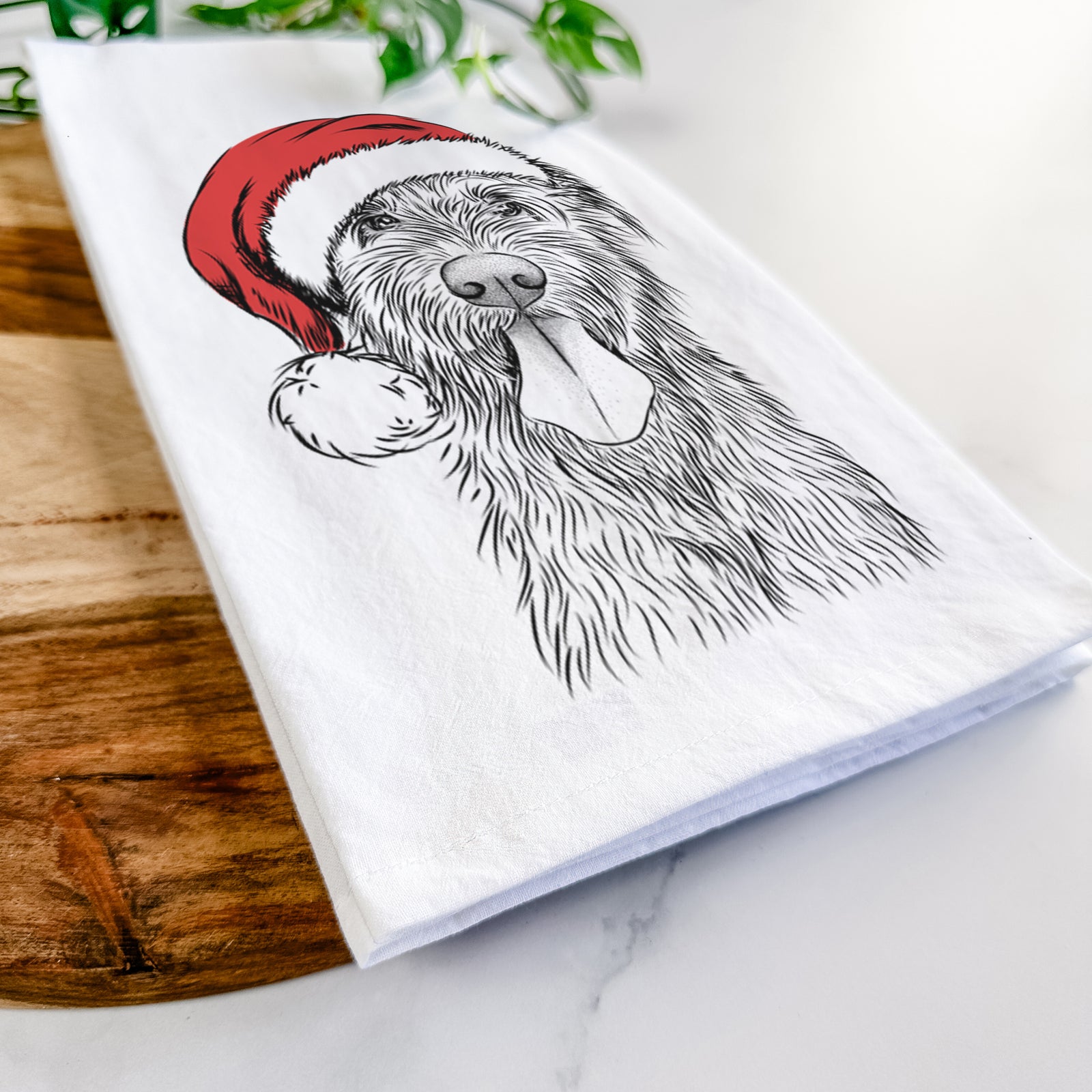Hand-drawn sketch of Sullivan the Irish Wolfhound wearing a Santa hat on a tea towel