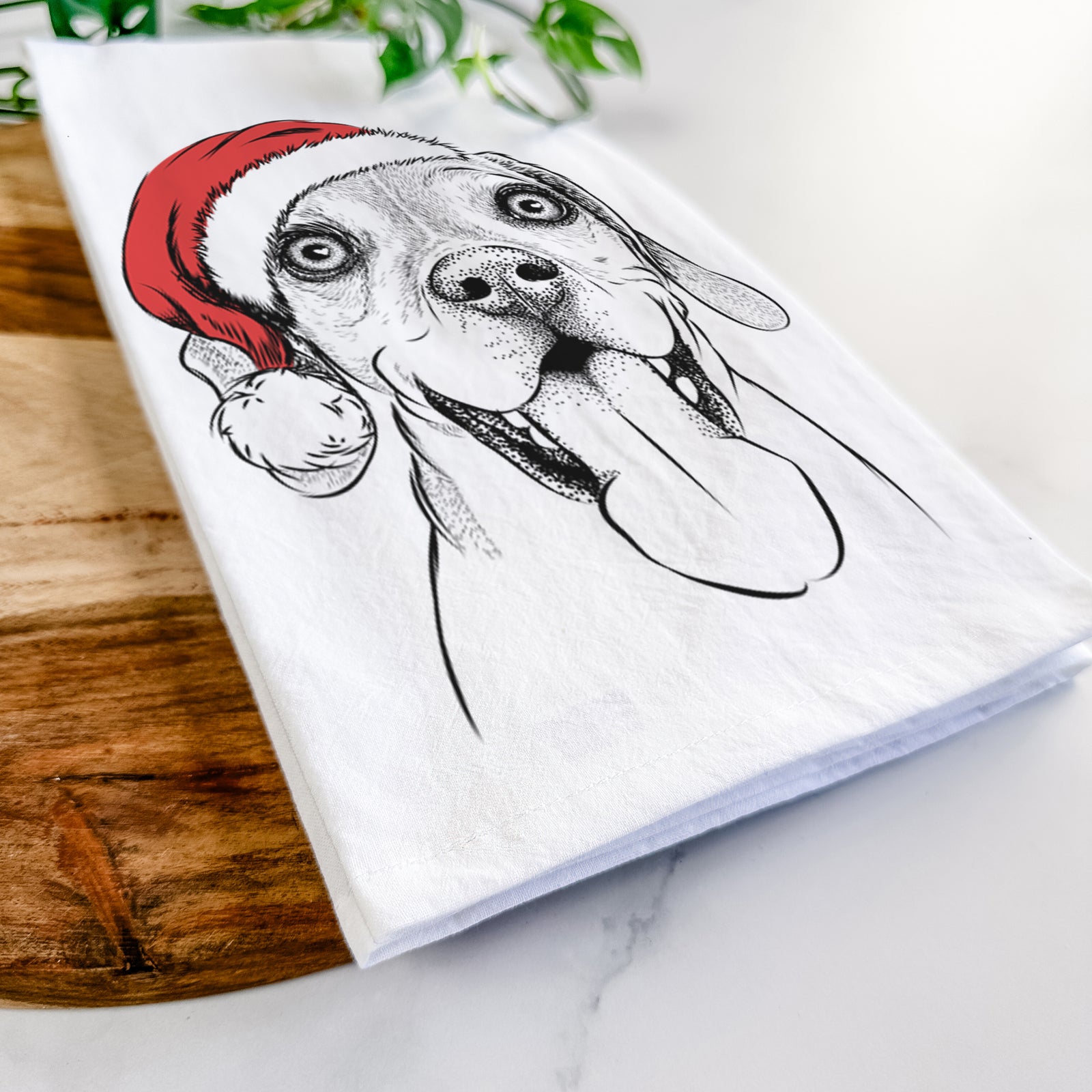Hand-drawn sketch of Sunny the Beagle wearing a Santa hat on a tea towel