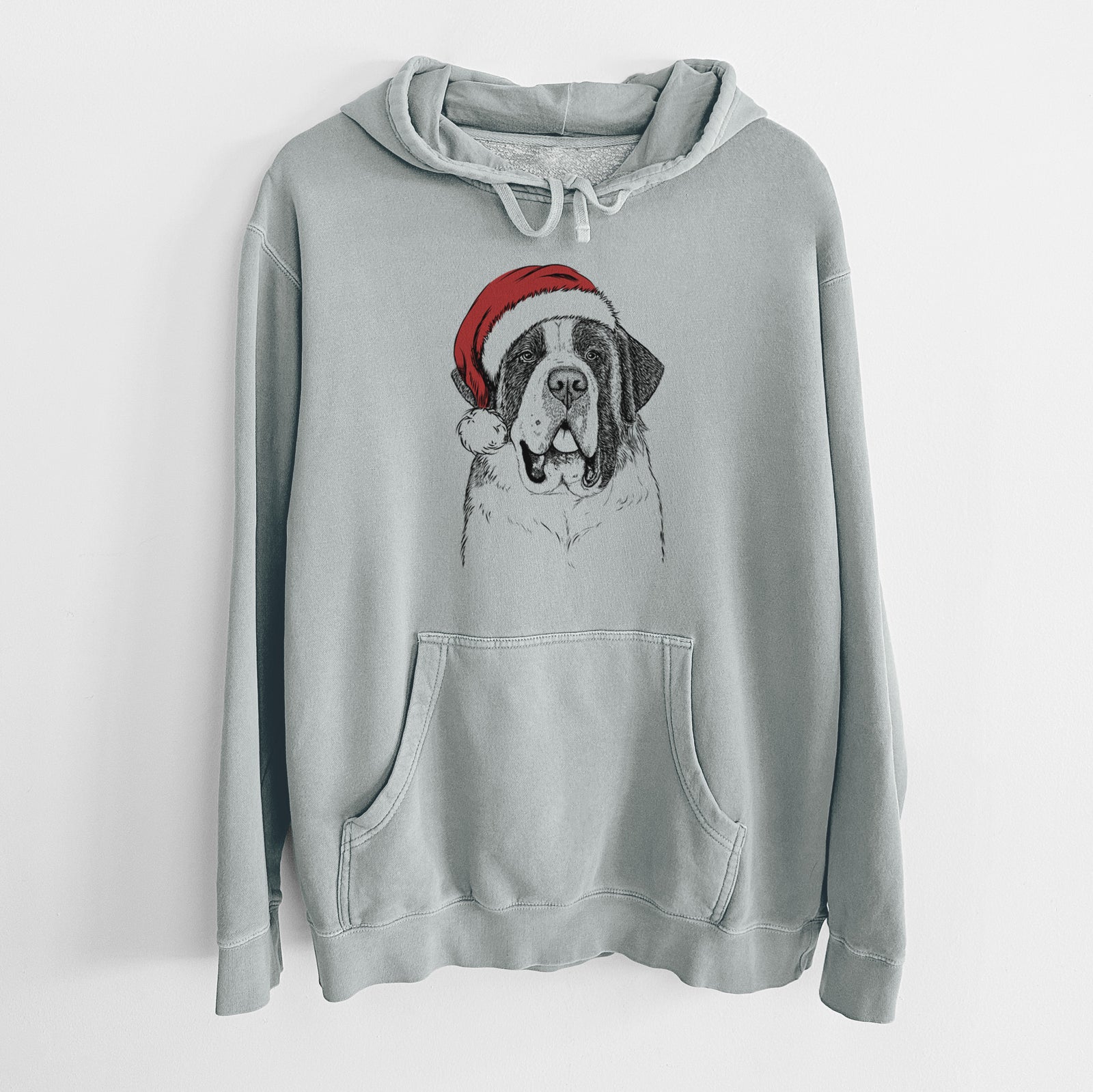 Hand-drawn sketch of Thor the Saint Bernard wearing a Santa hat on a Sage Unisex pigment dyed hoodie