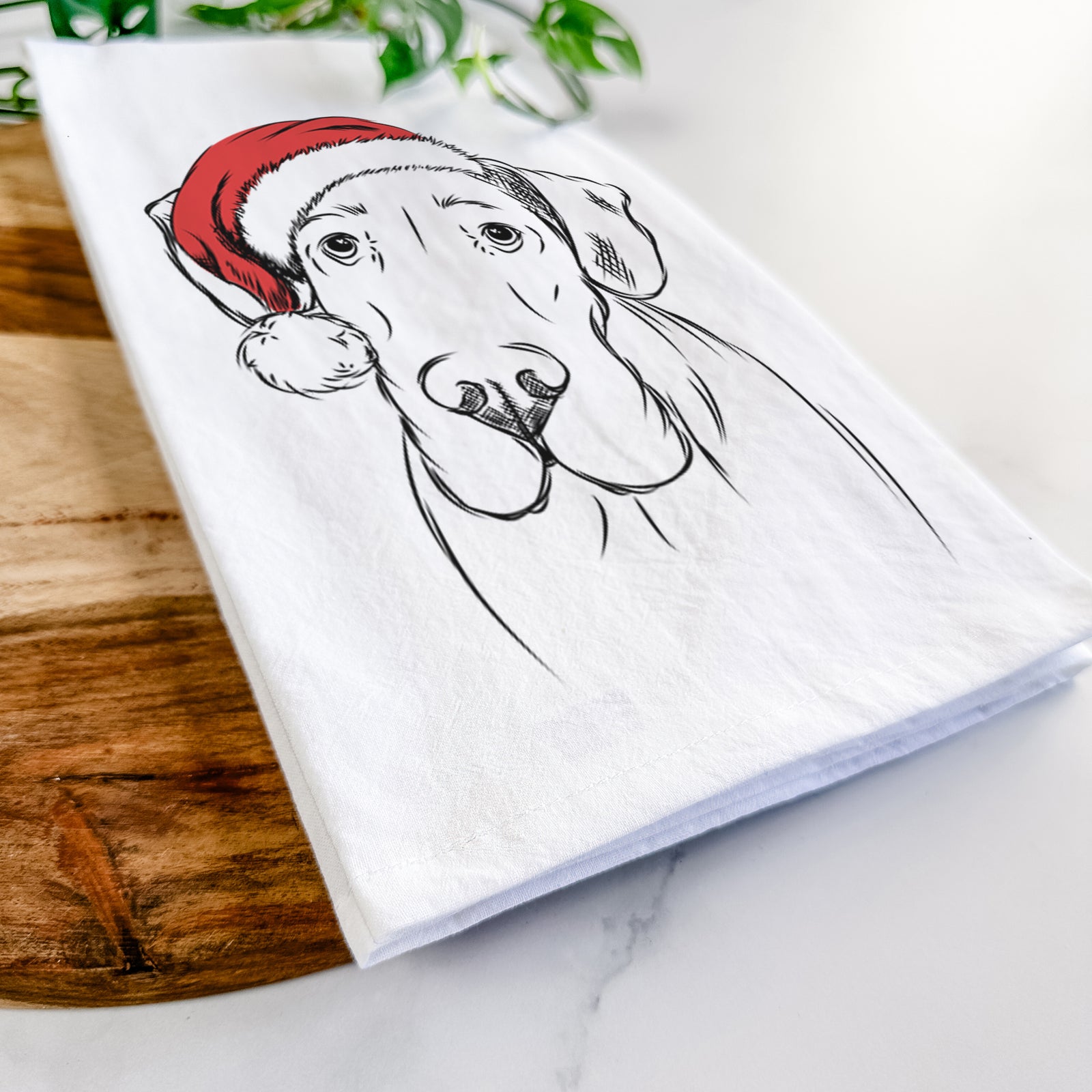 Hand-drawn sketch of Titus the Great Dane wearing a Santa hat on a tea towel