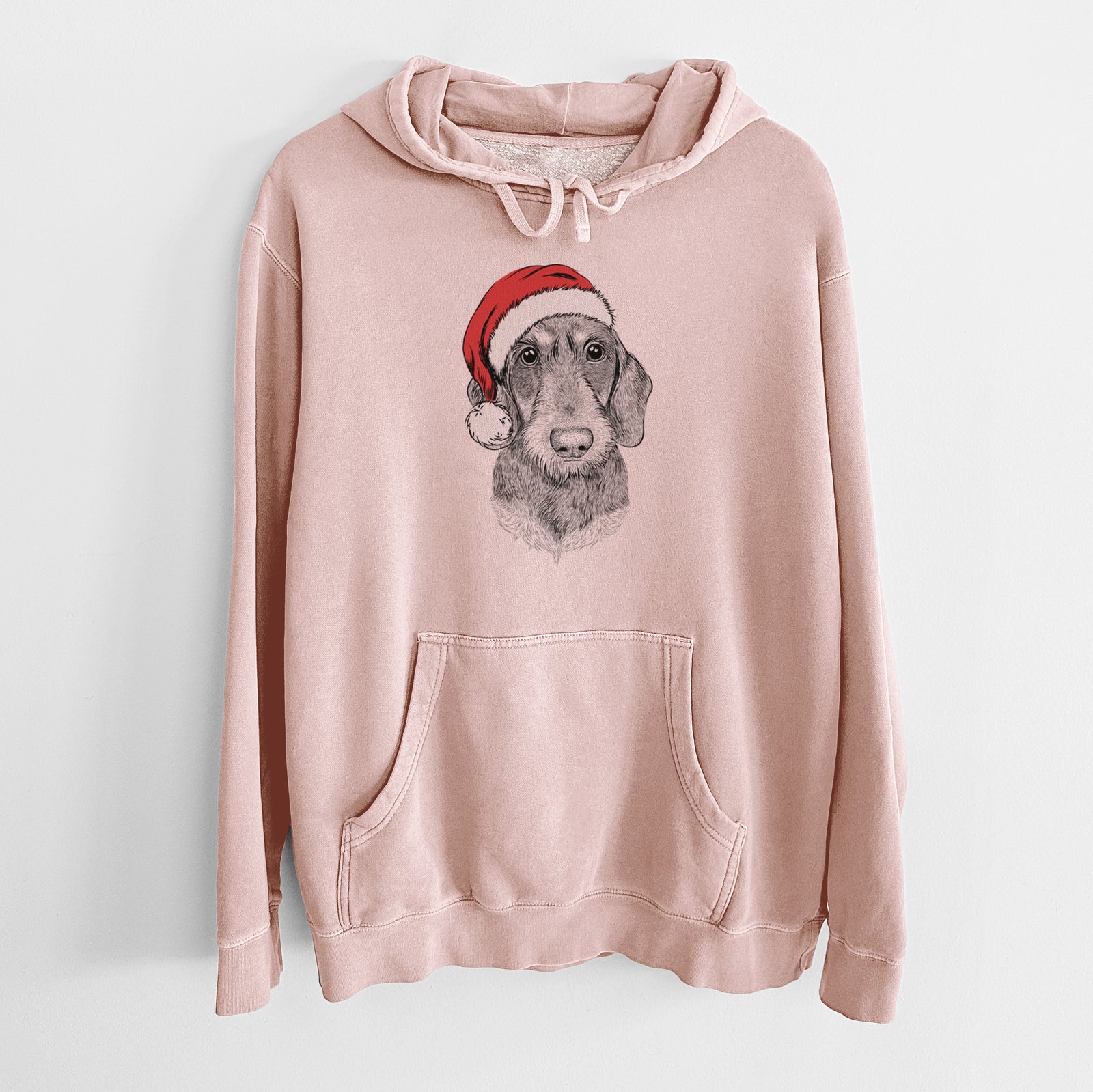 Hand-drawn sketch of Truman the Wirehaired Dachshund wearing a Santa hat on a Dusty Pink Unisex pigment dyed hoodie