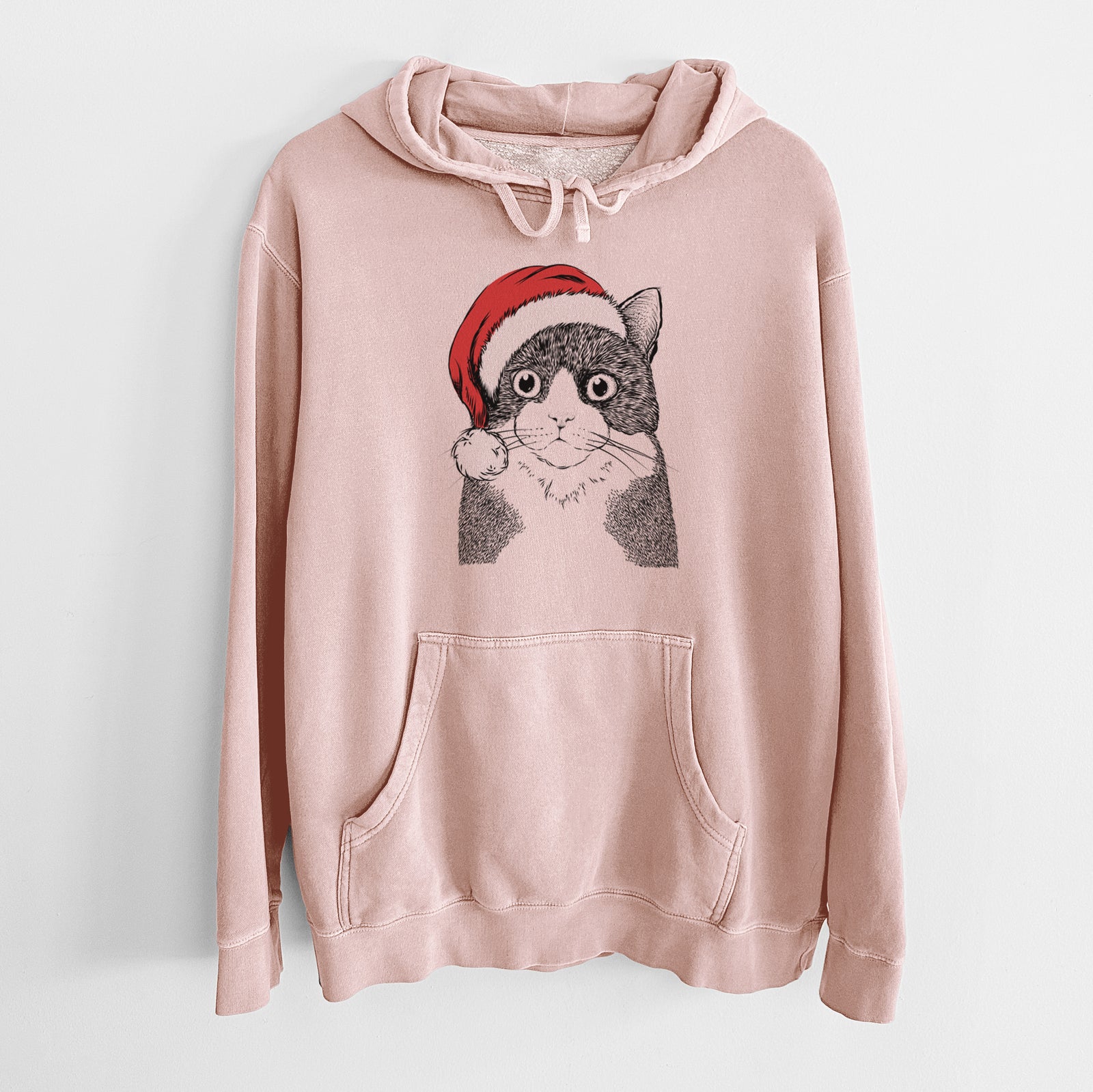 Hand-drawn sketch of Tux the Tuxedo Cat wearing a Santa hat on a Dusty Pink Unisex pigment dyed hoodie