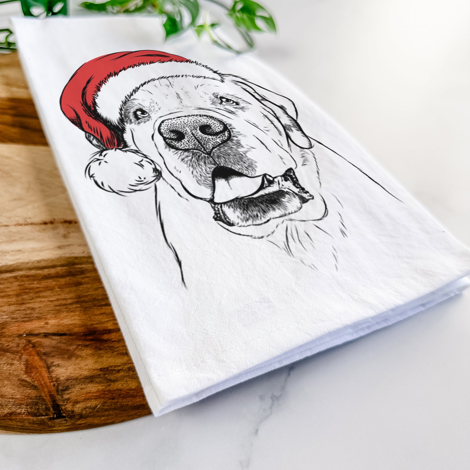 Hand-drawn sketch of Wendy the Saint Bernard wearing a Santa hat on a tea towel