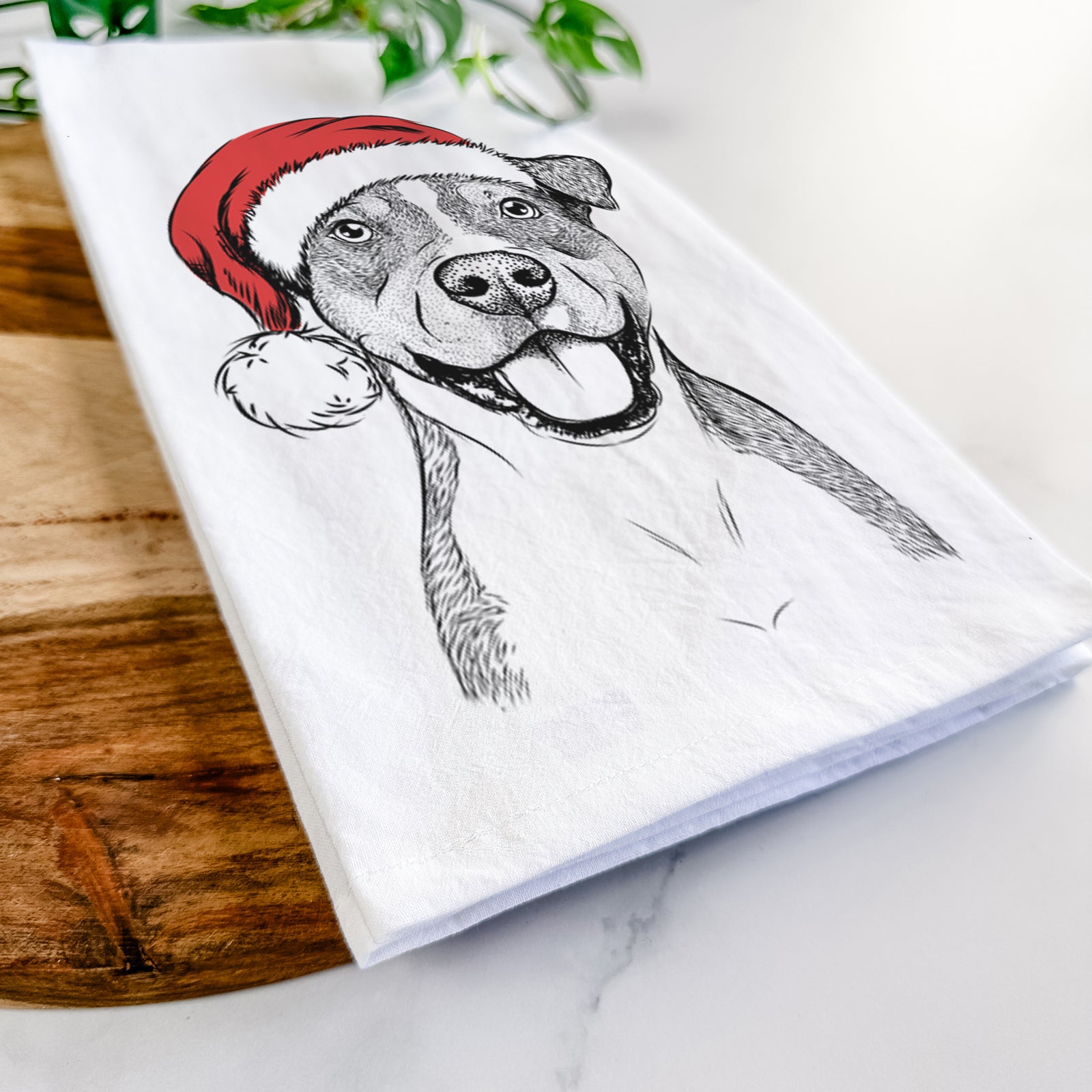 Hand-drawn sketch of Wendy the Mixed Breed wearing a Santa hat on a tea towel