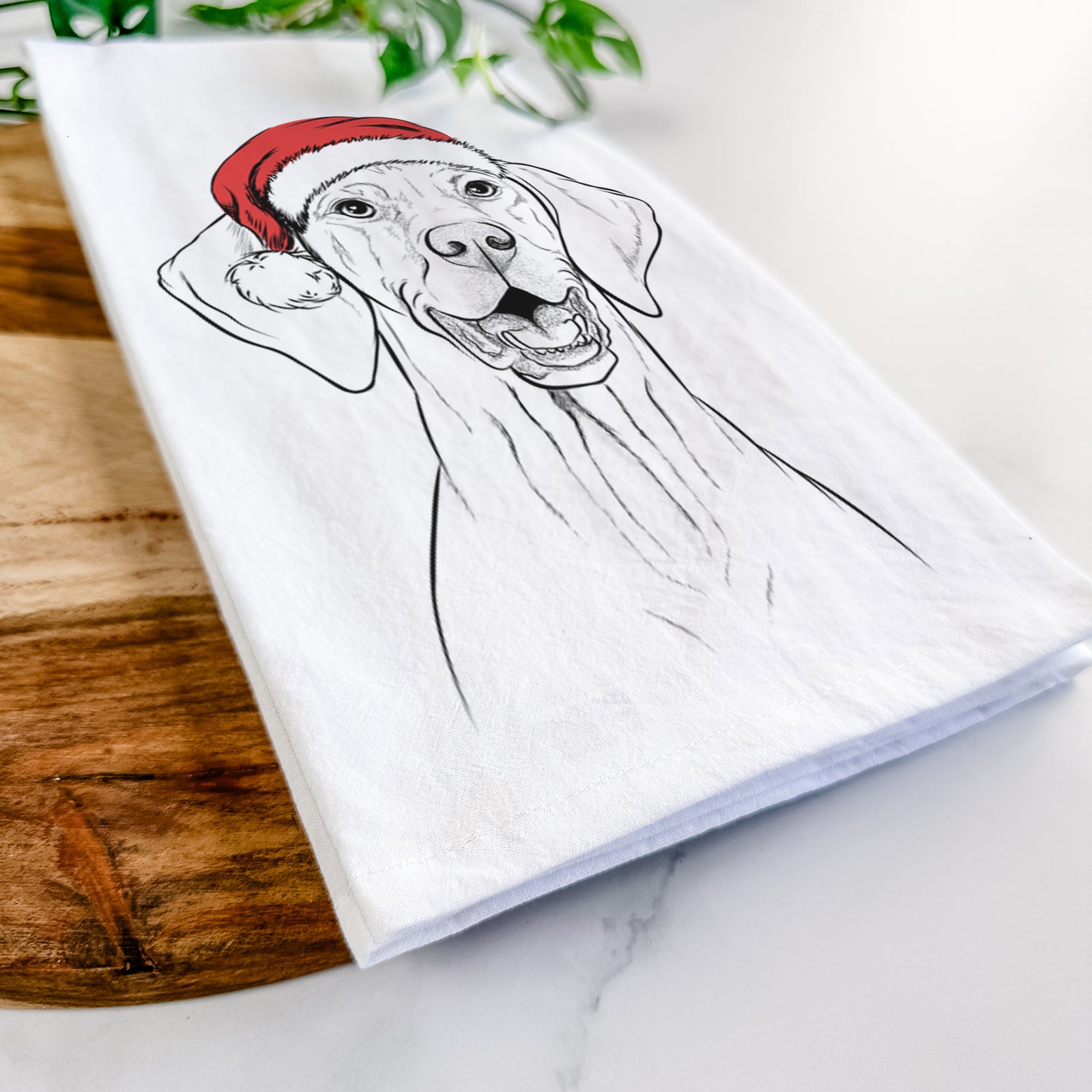 Hand-drawn sketch of Wesley the Vizsla wearing a Santa hat on a tea towel
