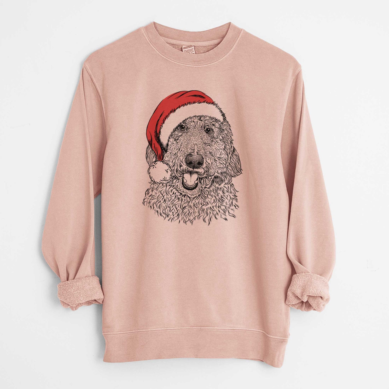 Hand-drawn sketch of Whisper the Goldendoodle wearing a Santa hat on a Dusty Pink Unisex pigment dyed crew sweatshirt