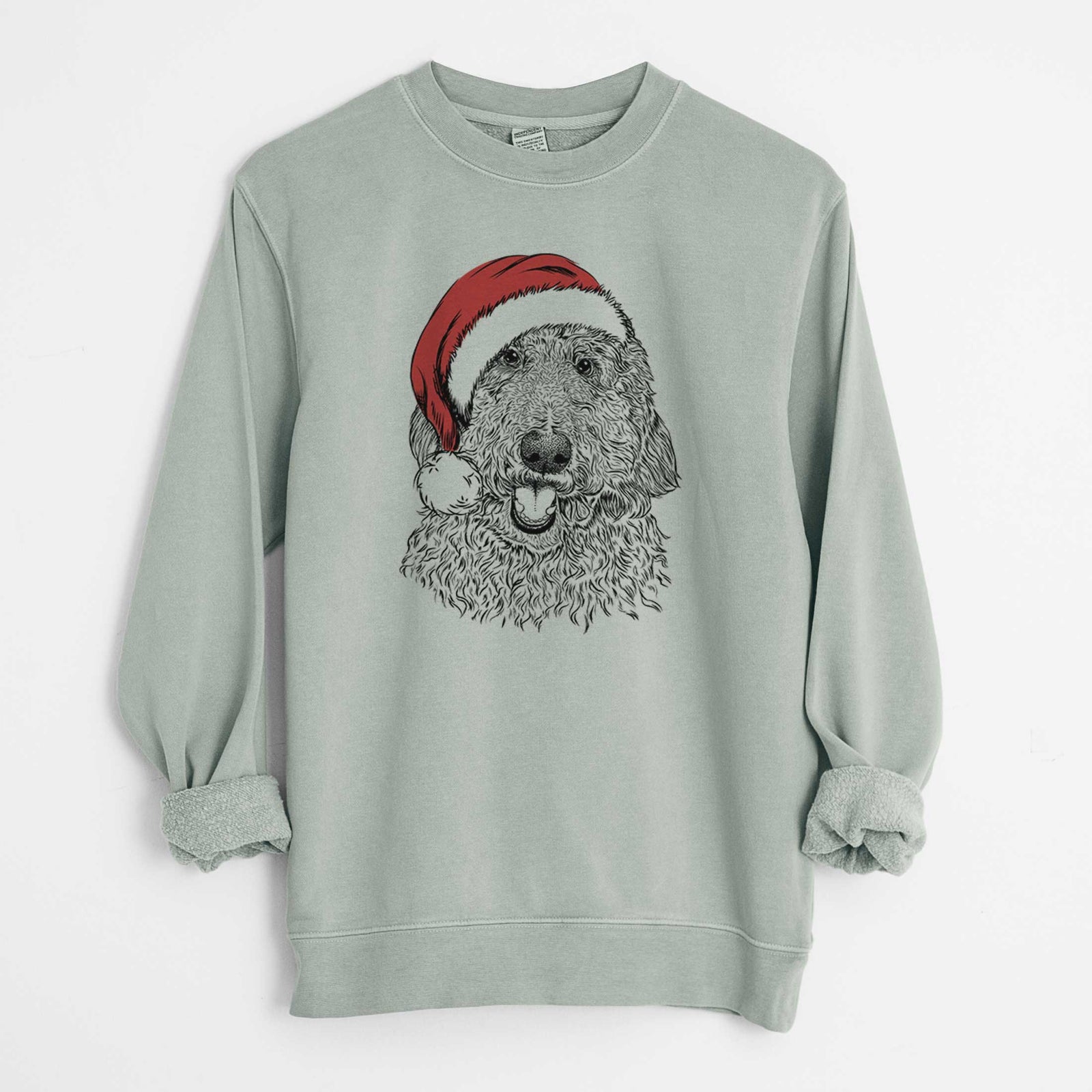 Hand-drawn sketch of Whisper the Goldendoodle wearing a Santa hat on a Sage Unisex pigment dyed crew sweatshirt