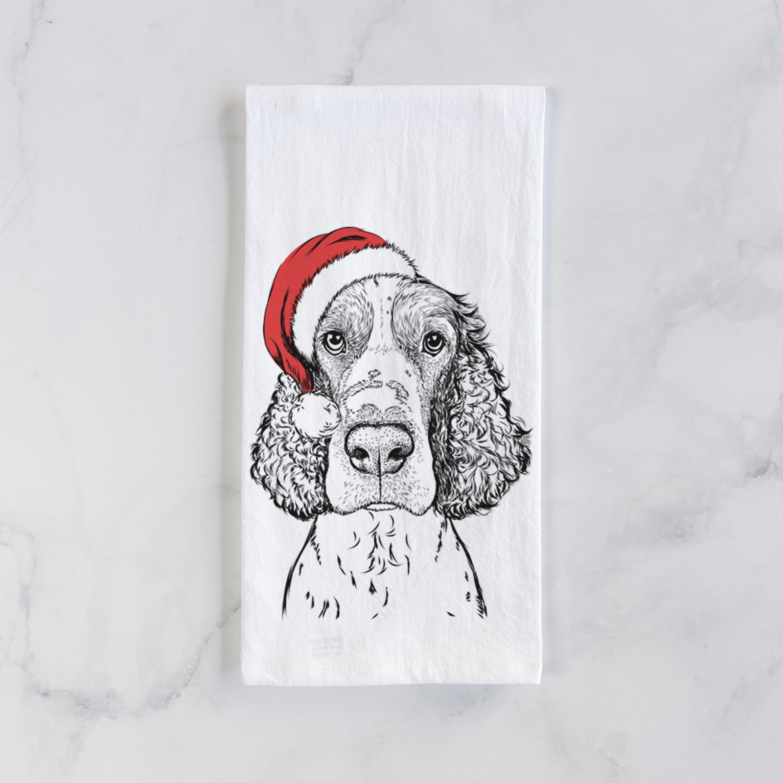 Hand-drawn sketch of Wilbur the English Springer Spaniel wearing a Santa hat on a tea towel