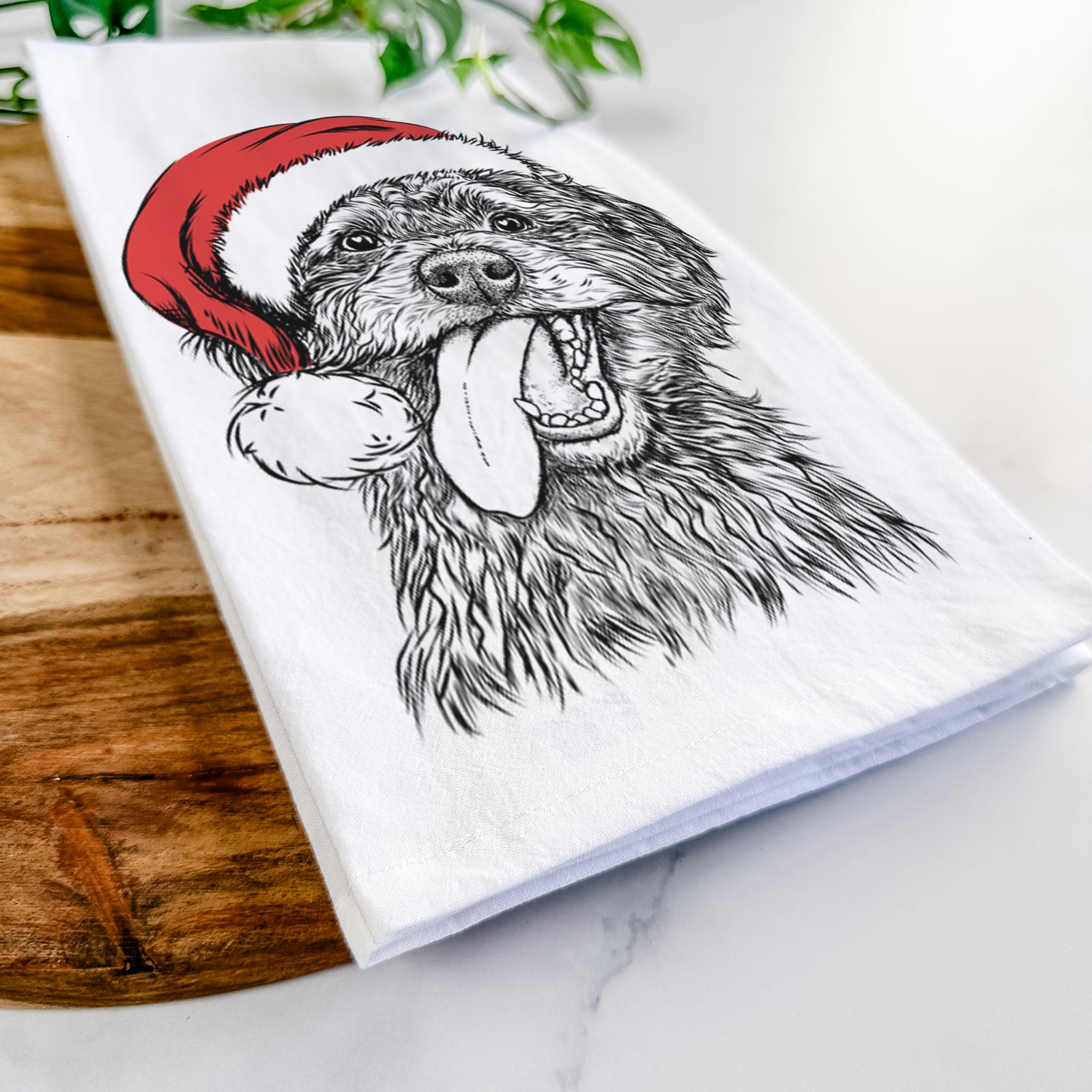 Hand-drawn sketch of Winnie the Mini Aussiedoodle wearing a Santa hat on a tea towel