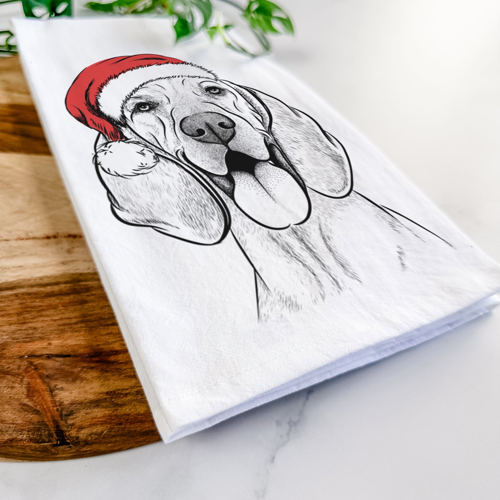 Hand-drawn sketch of Winston the Redbone Coonhound wearing a Santa hat on a tea towel