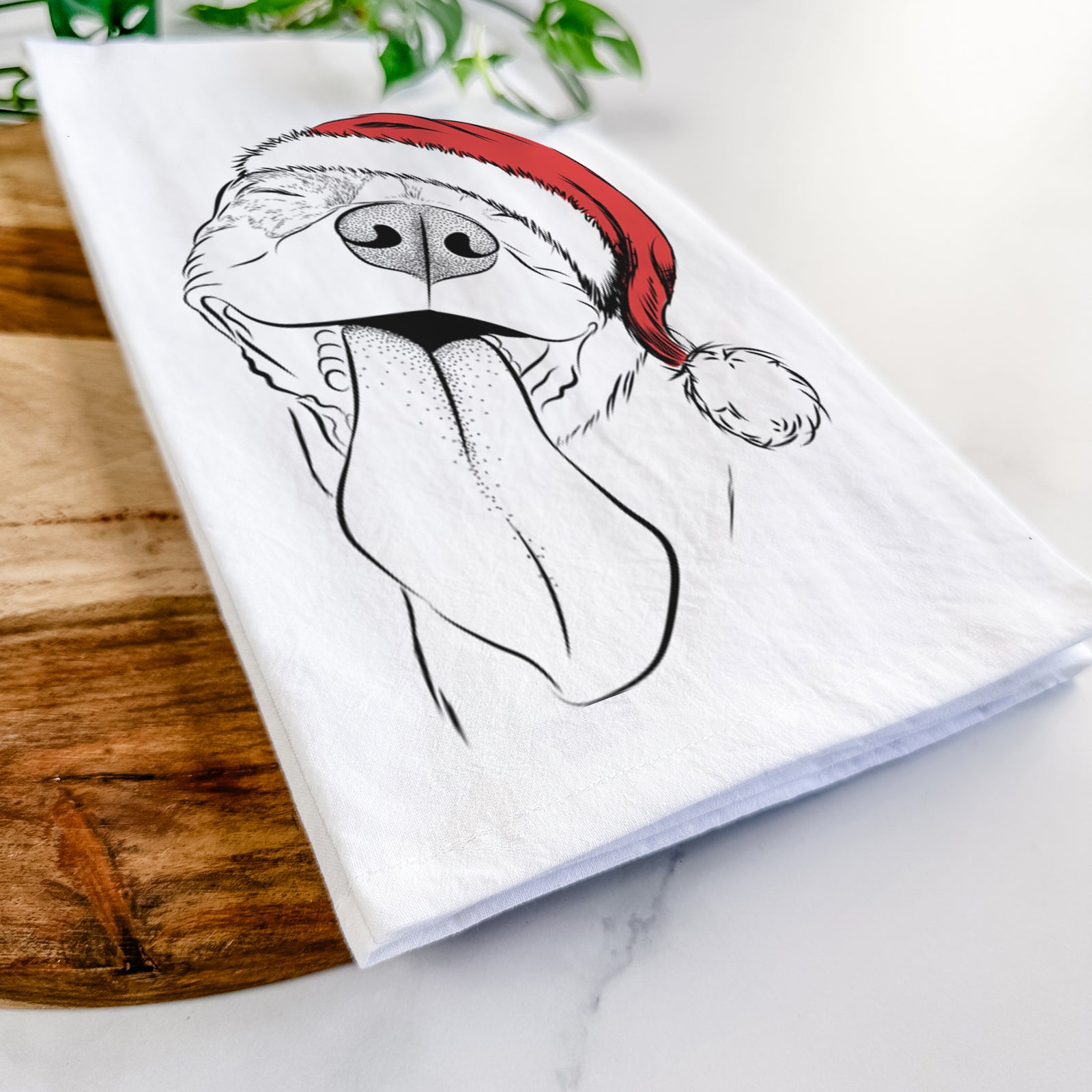 Hand-drawn sketch of Xena the American Staffordshire Terrier wearing a Santa hat on a tea towel