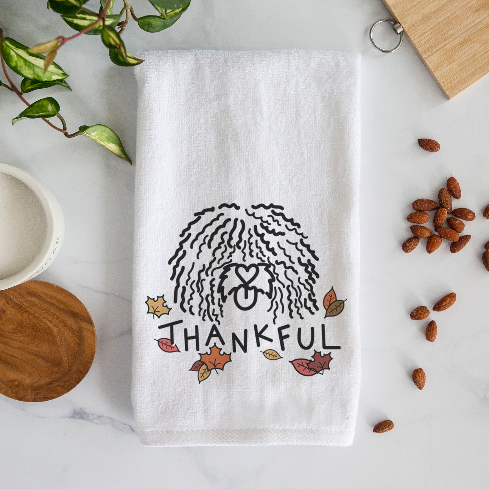 Minimalist line drawing of Alba the Spanish Water Dog with 'Thankful' lettering on a decorative hand towel