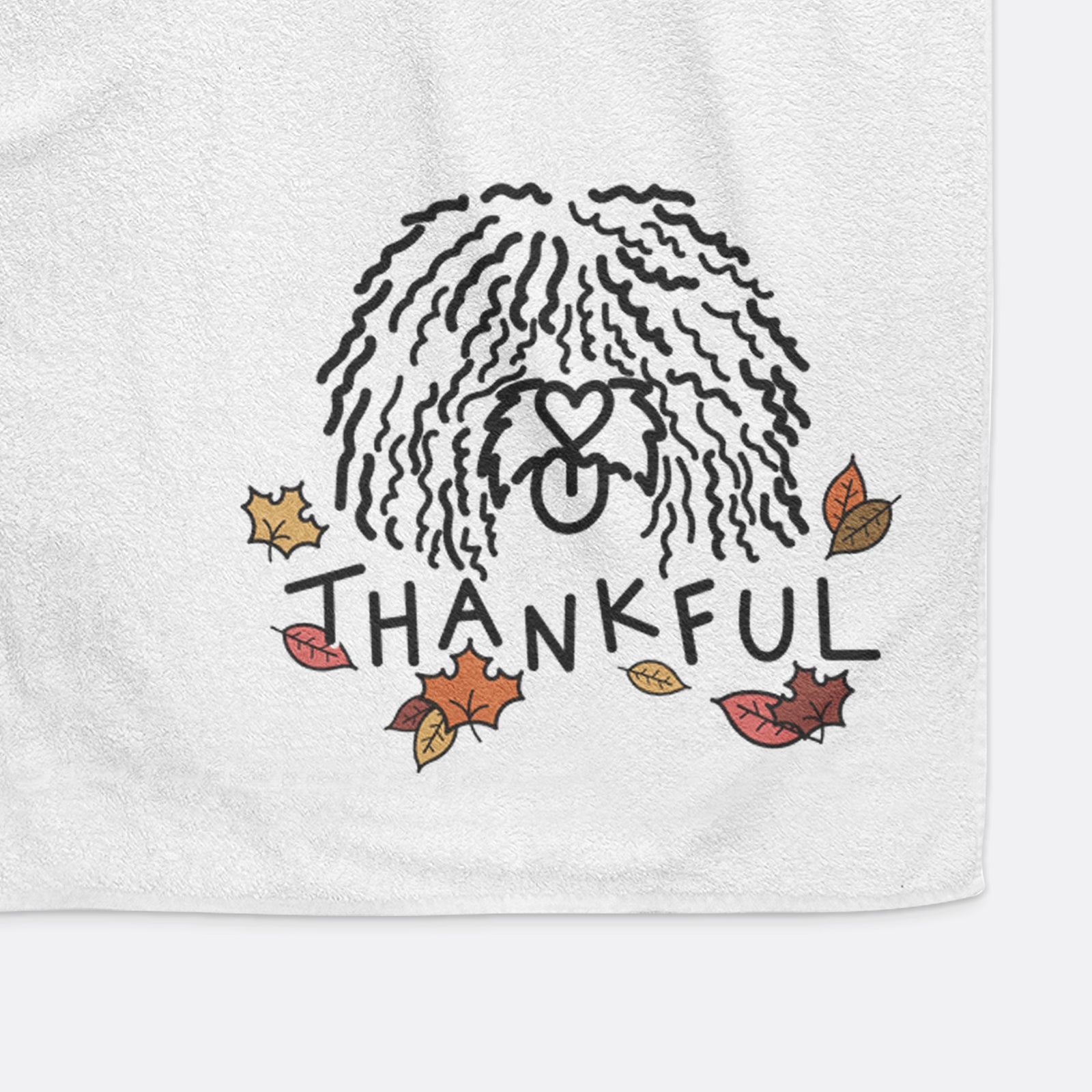 Minimalist line drawing of Alba the Spanish Water Dog with 'Thankful' lettering on a decorative hand towel