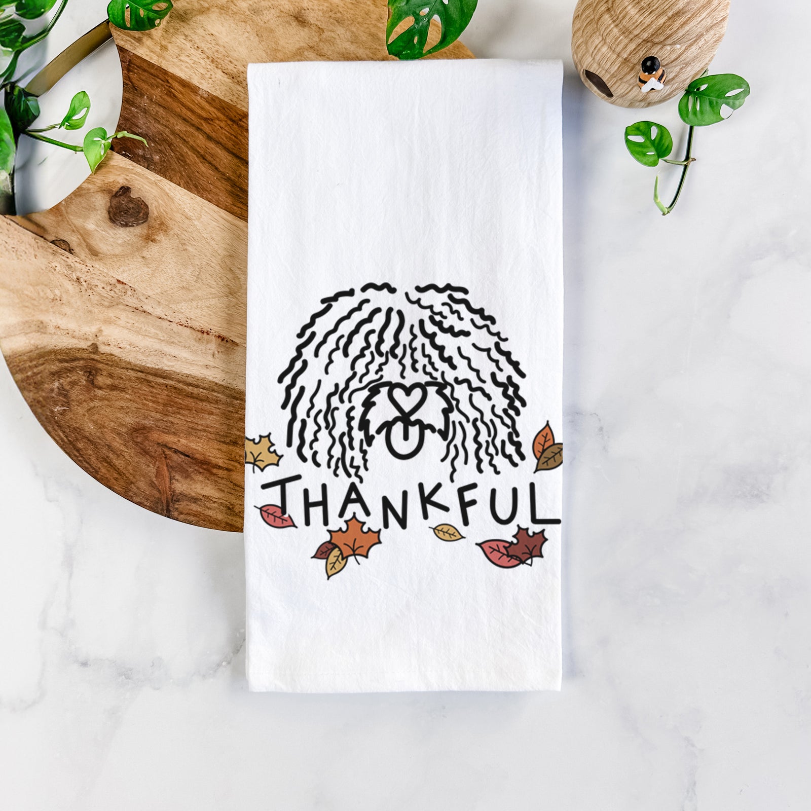 Minimalist line drawing of Alba the Spanish Water Dog with 'Thankful' lettering on a tea towel