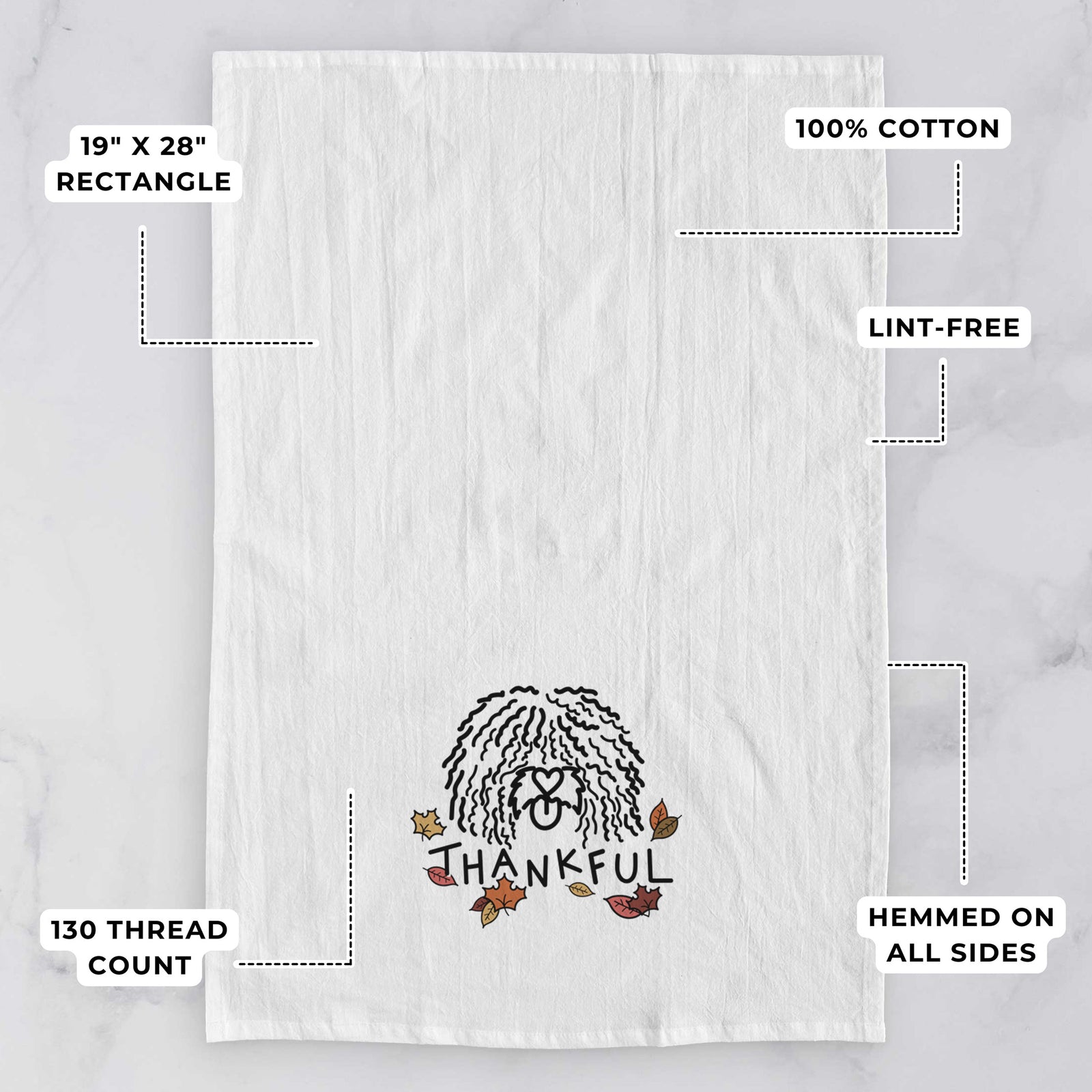 Minimalist line drawing of Alba the Spanish Water Dog with 'Thankful' lettering on a tea towel, with feature callouts: 19 x 28 inch rectangle, 100% cotton, lint-free, 120 thread count, hemmed on all sides