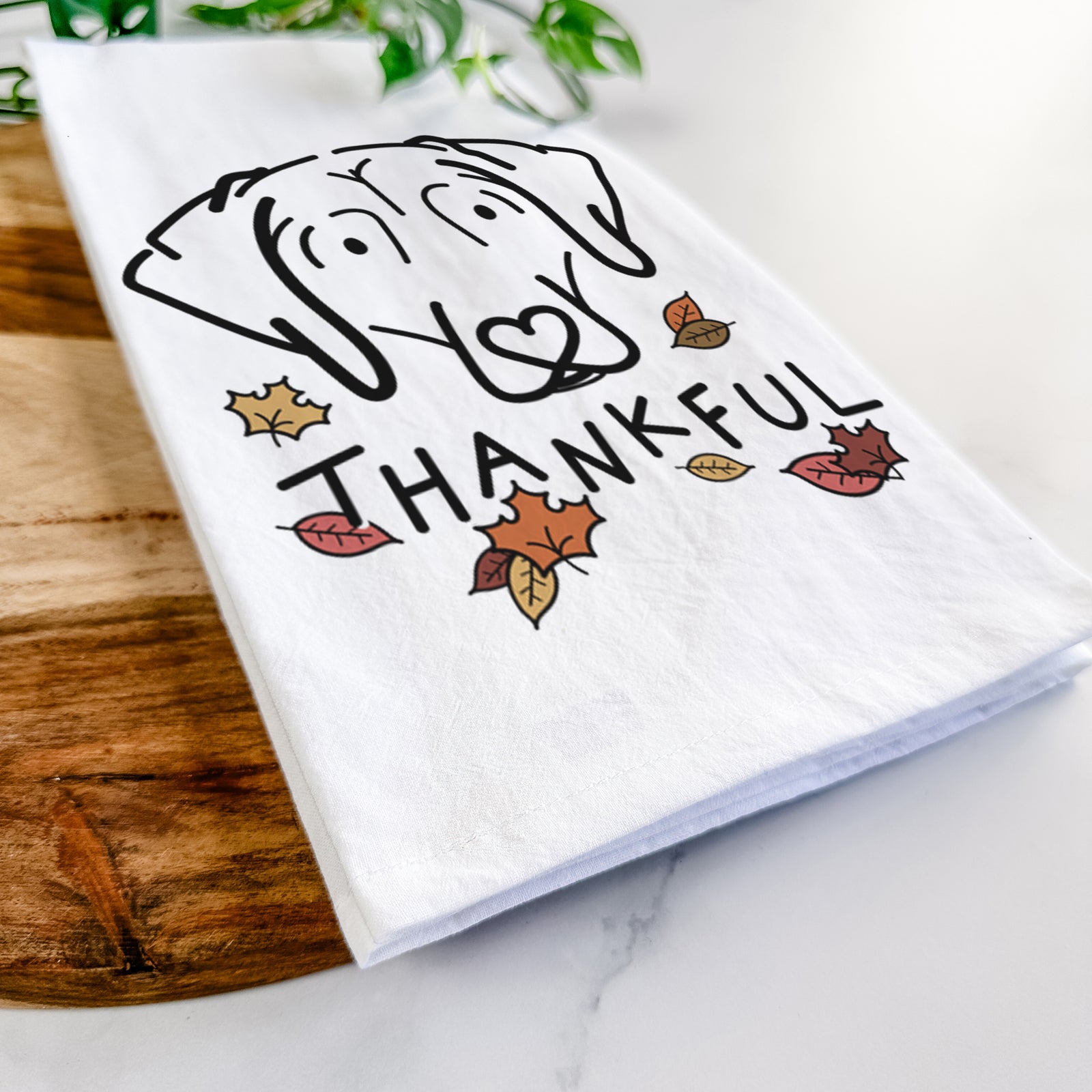 Minimalist line drawing of Aly the Beagle with 'Thankful' lettering on a tea towel