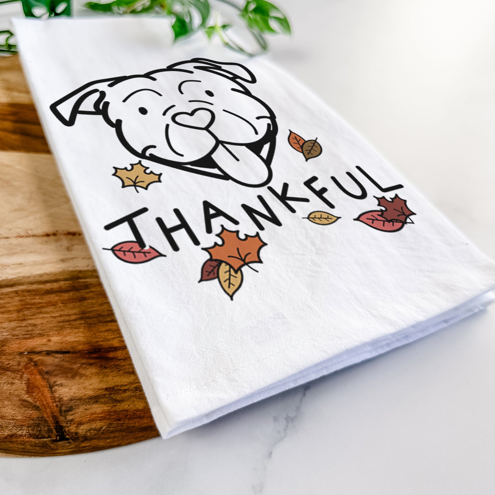 Minimalist line drawing of an American Bulldog with 'Thankful' lettering on a tea towel