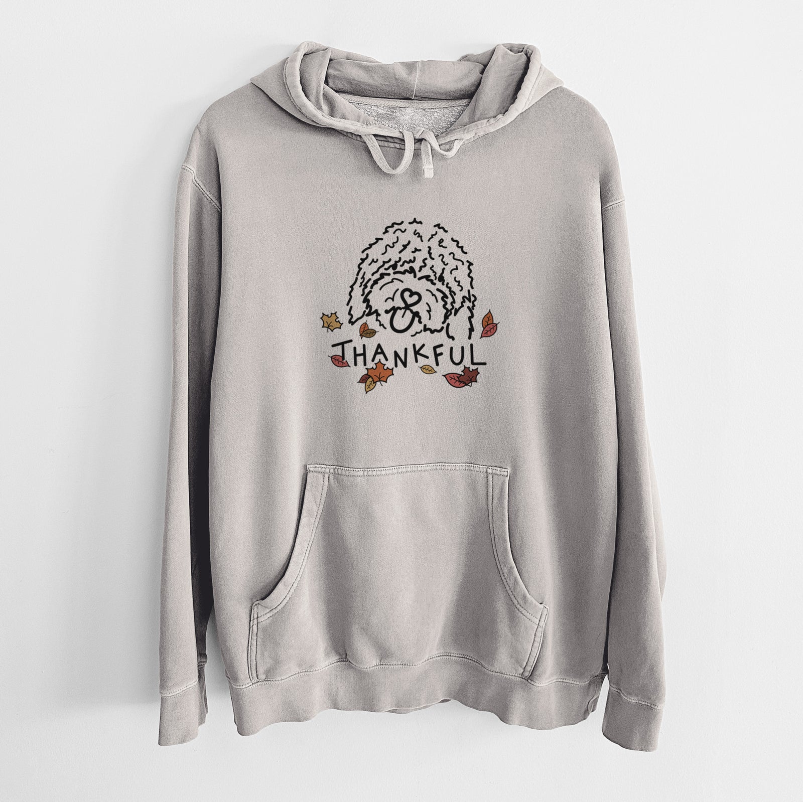 Minimalist line drawing of Antonio the Spanish Water Dog with 'Thankful' lettering on a Cement Unisex pigment dyed hoodie
