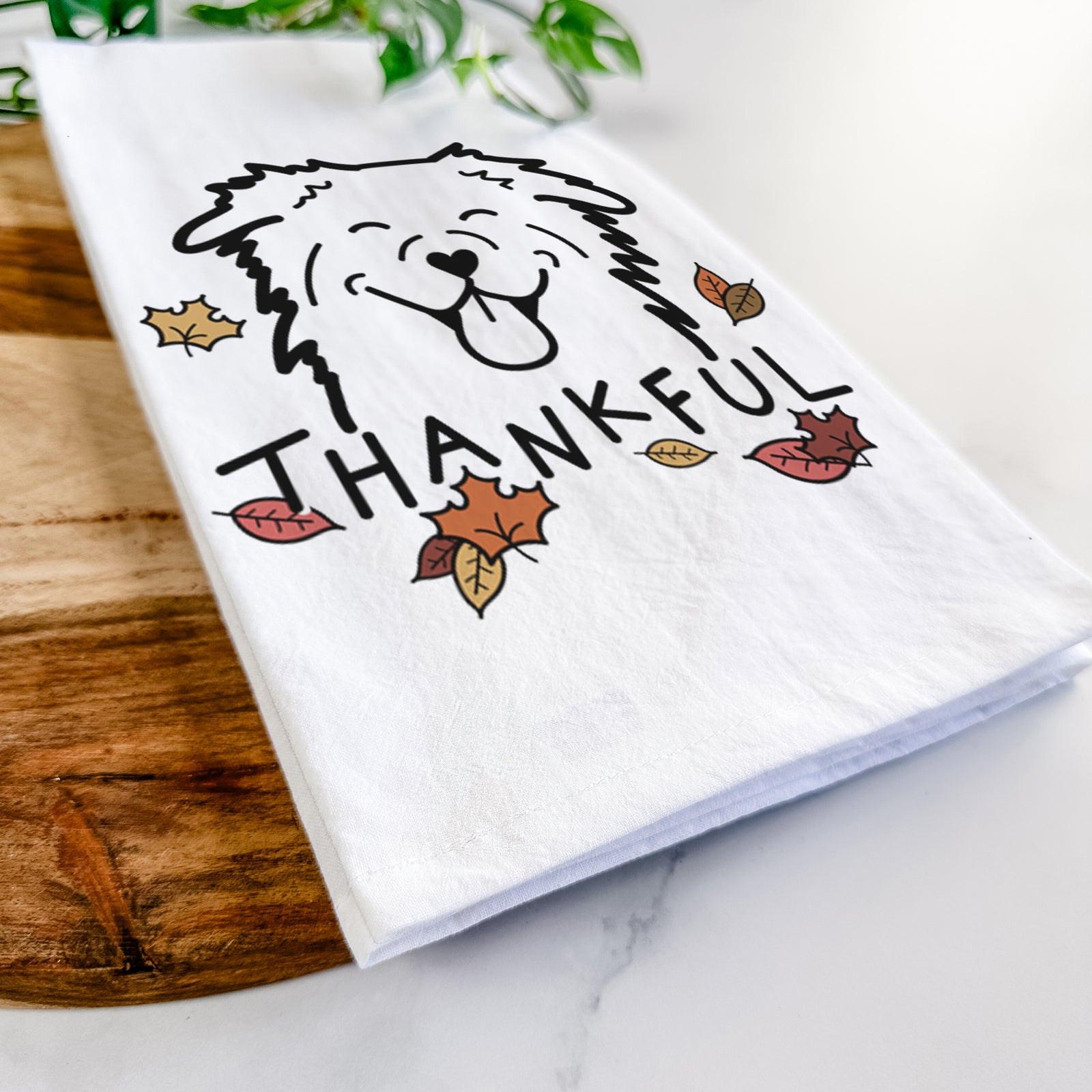 Minimalist line drawing of an Australian Shepherd with 'Thankful' lettering on a tea towel