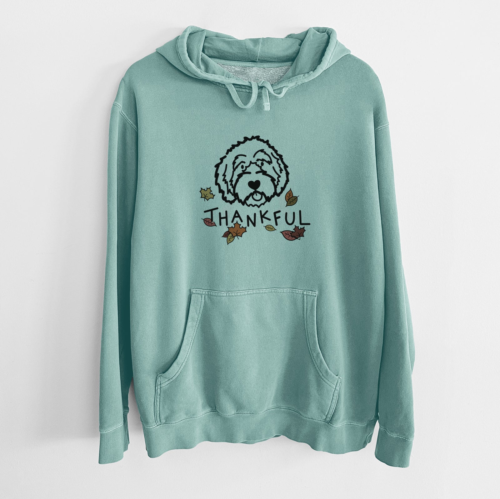 Minimalist line drawing of an Aussiedoodle with 'Thankful' lettering on a Mint Unisex pigment dyed hoodie