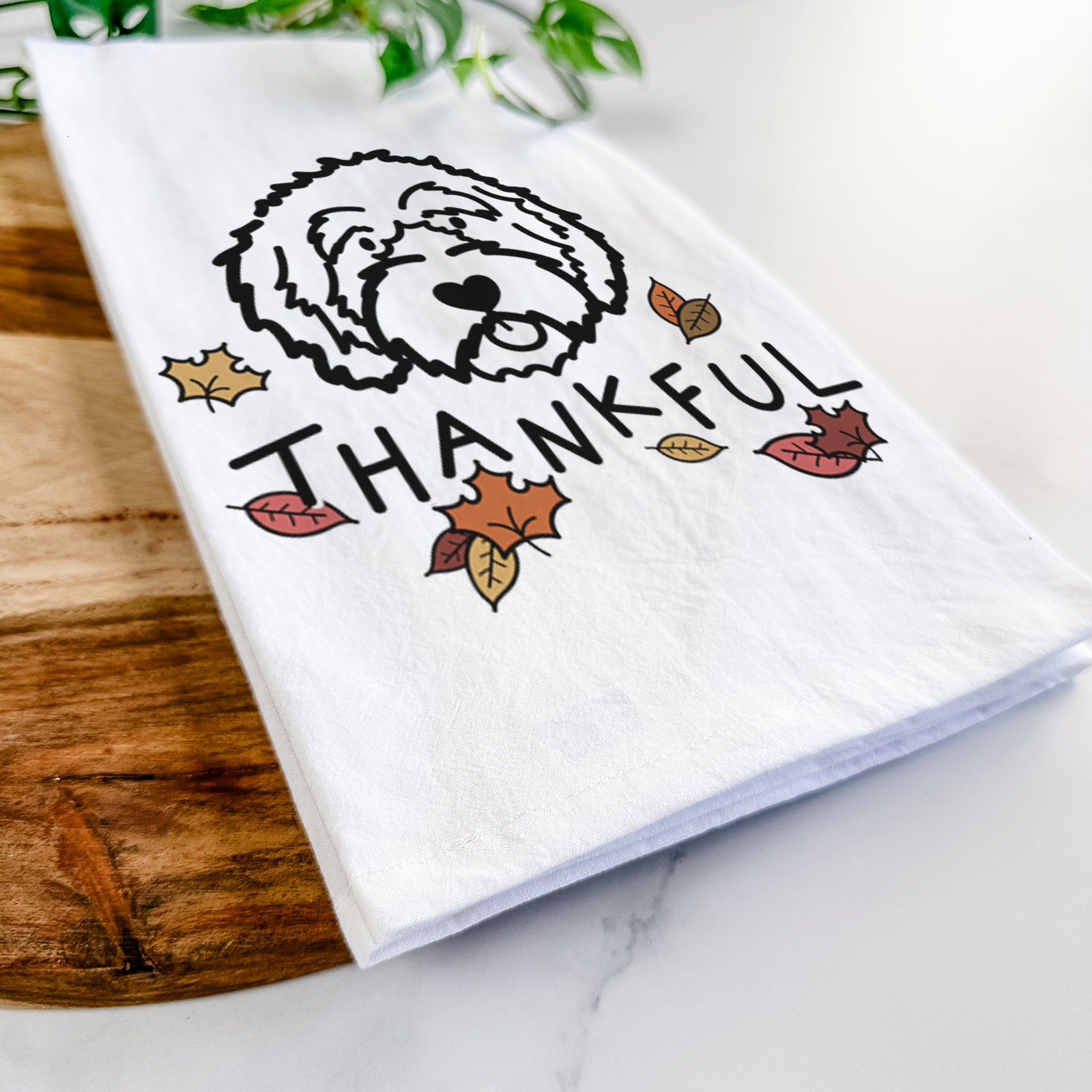 Minimalist line drawing of an Aussiedoodle with 'Thankful' lettering on a tea towel