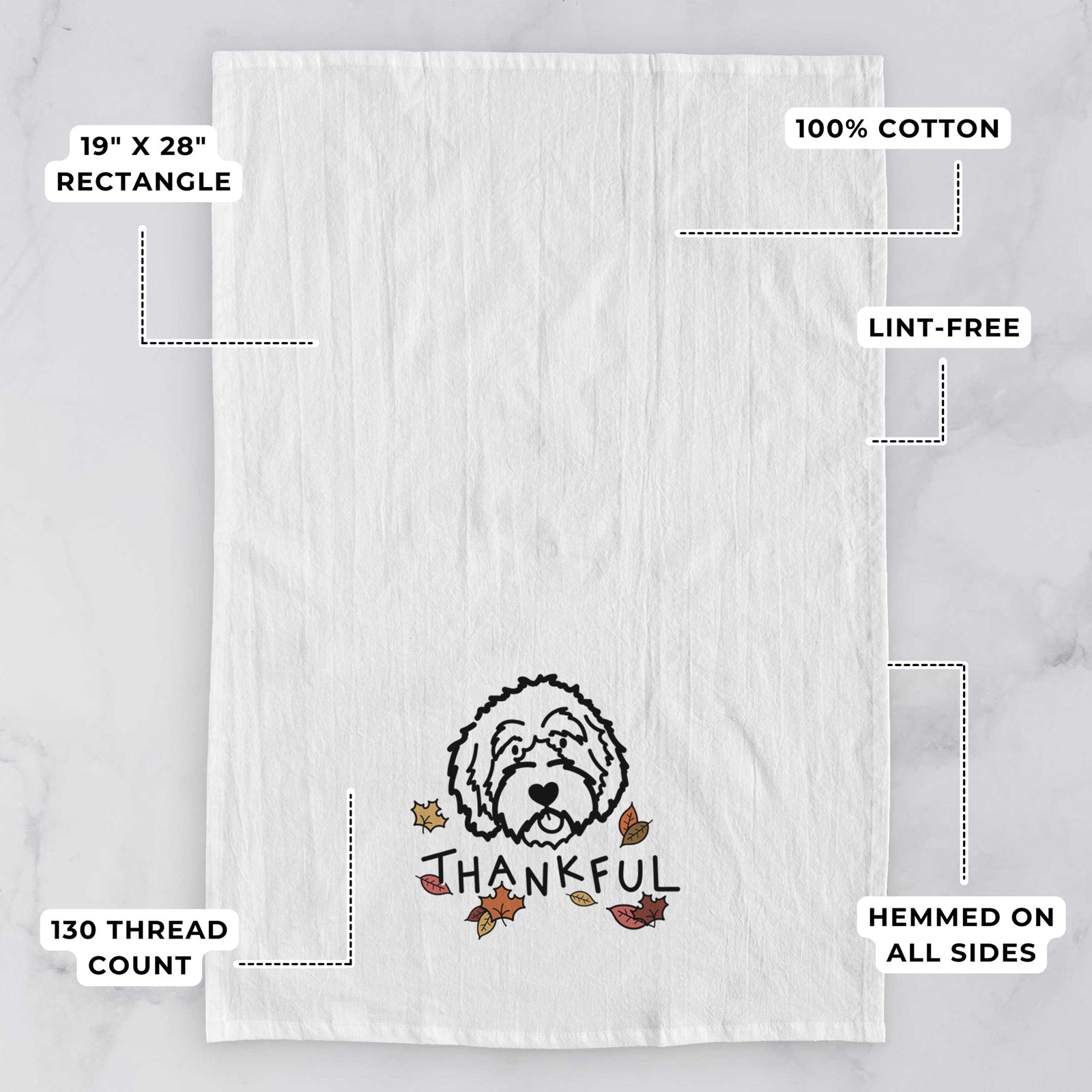 Minimalist line drawing of an Aussiedoodle with 'Thankful' lettering on a tea towel, with feature callouts: 19 x 28 inch rectangle, 100% cotton, lint-free, 120 thread count, hemmed on all sides