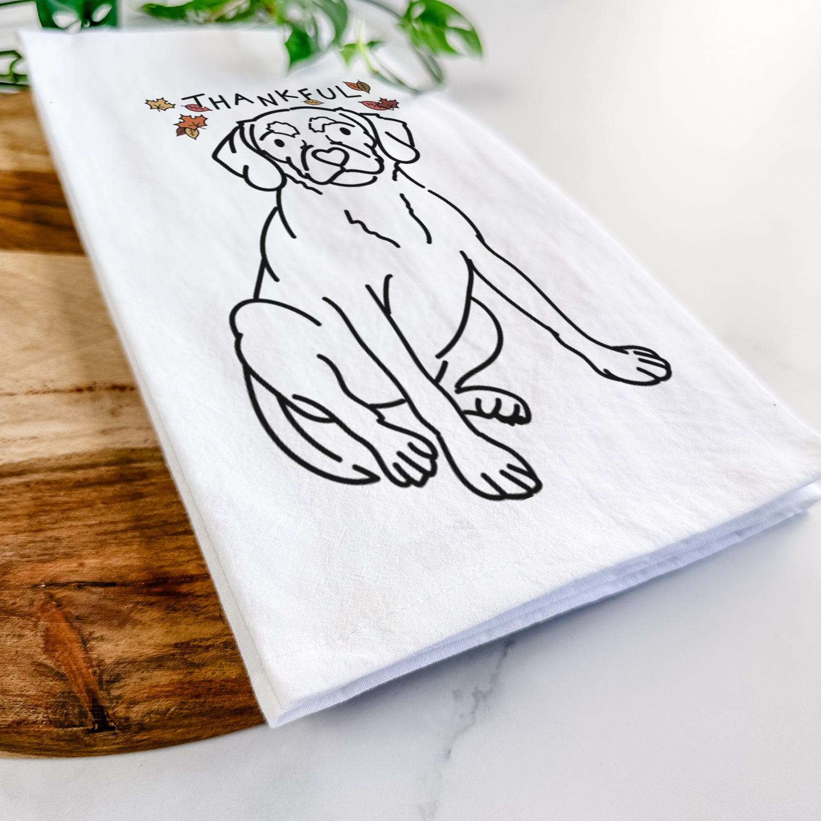 Minimalist line drawing of Babs the Puggle with 'Thankful' lettering on a tea towel