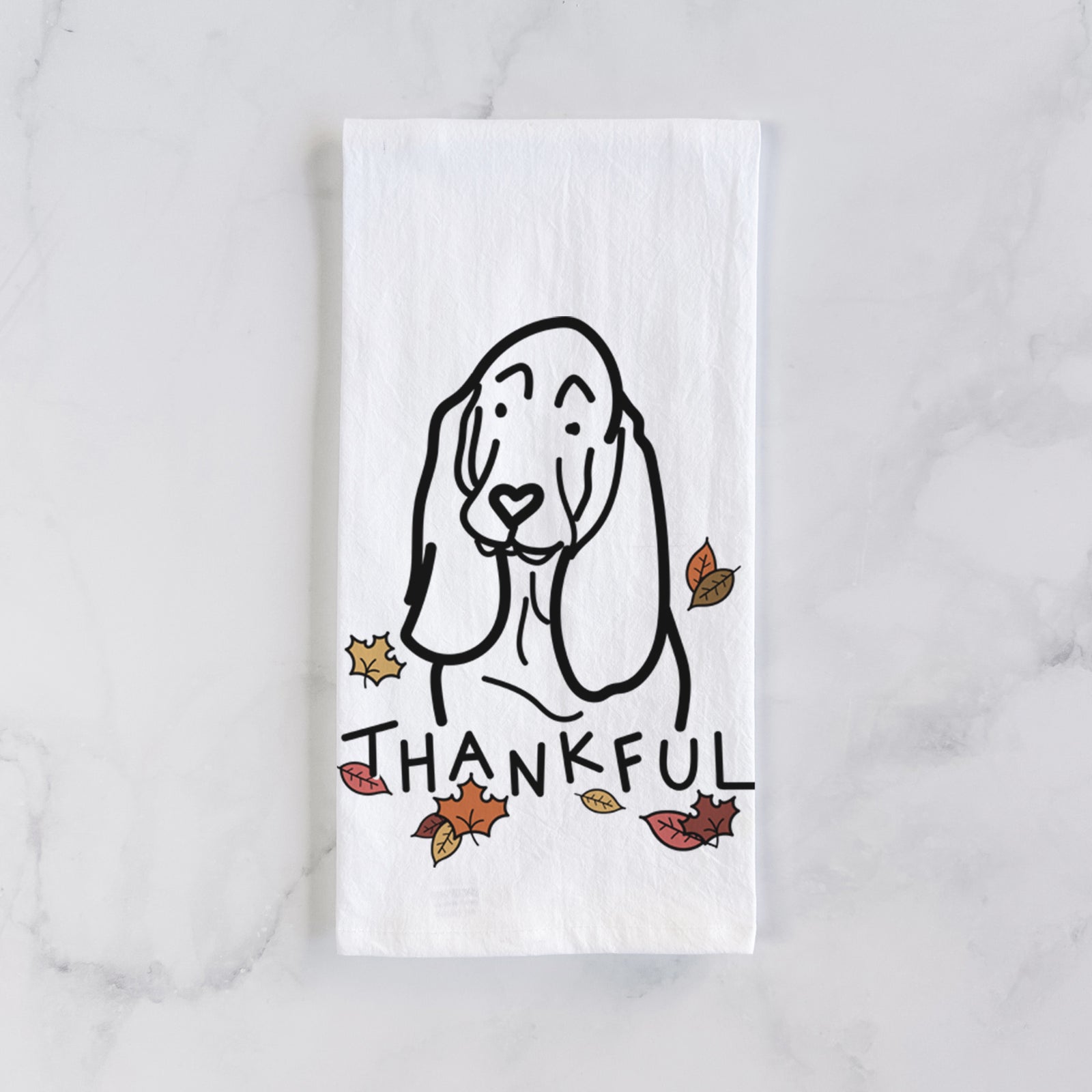 Minimalist line drawing of a Basset Hound with 'Thankful' lettering on a tea towel