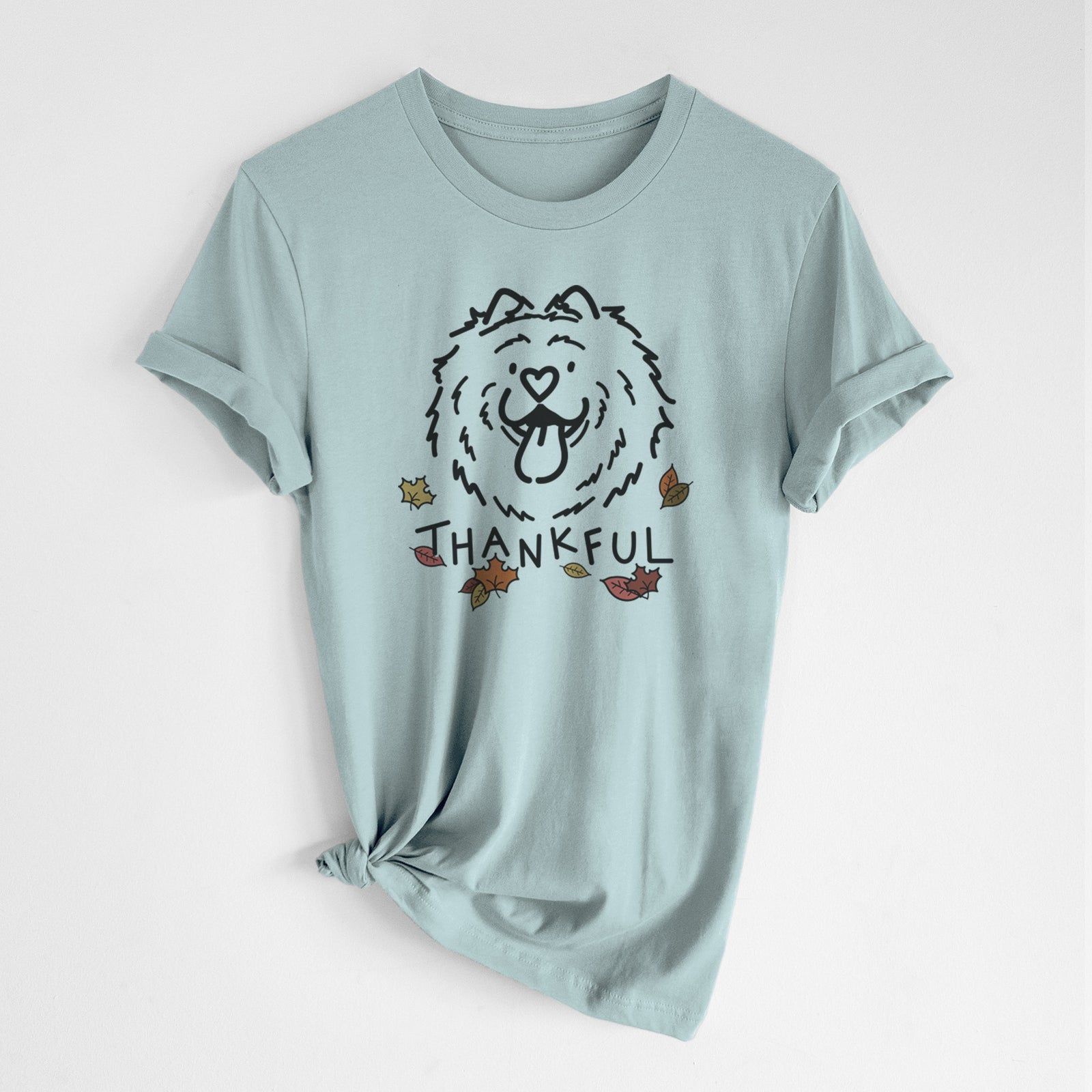 Minimalist line drawing of Bear the Chow Chow with 'Thankful' lettering on a Dusty Blue Unisex crewneck, worn by a woman