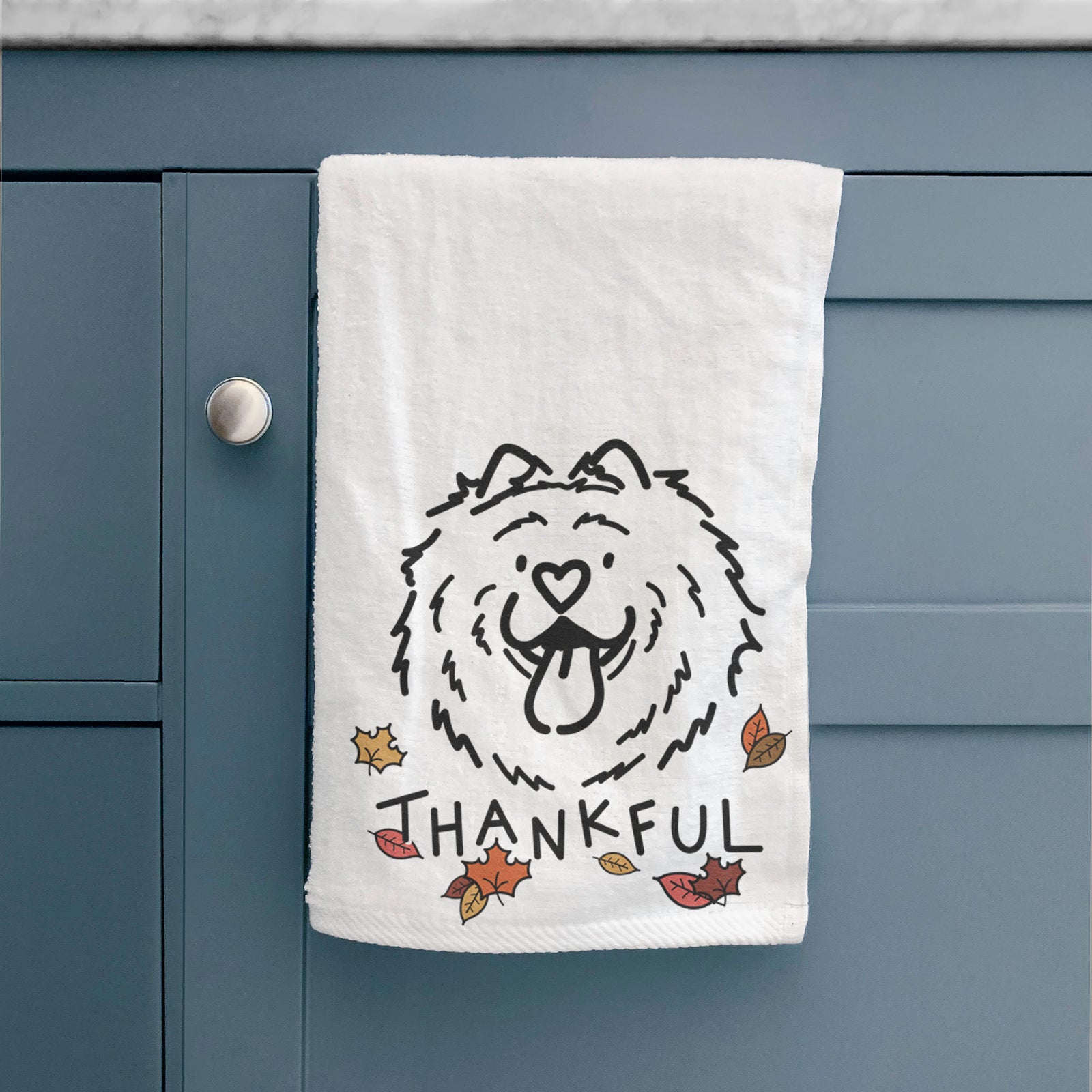 Minimalist line drawing of Bear the Chow Chow with 'Thankful' lettering on a hand towel