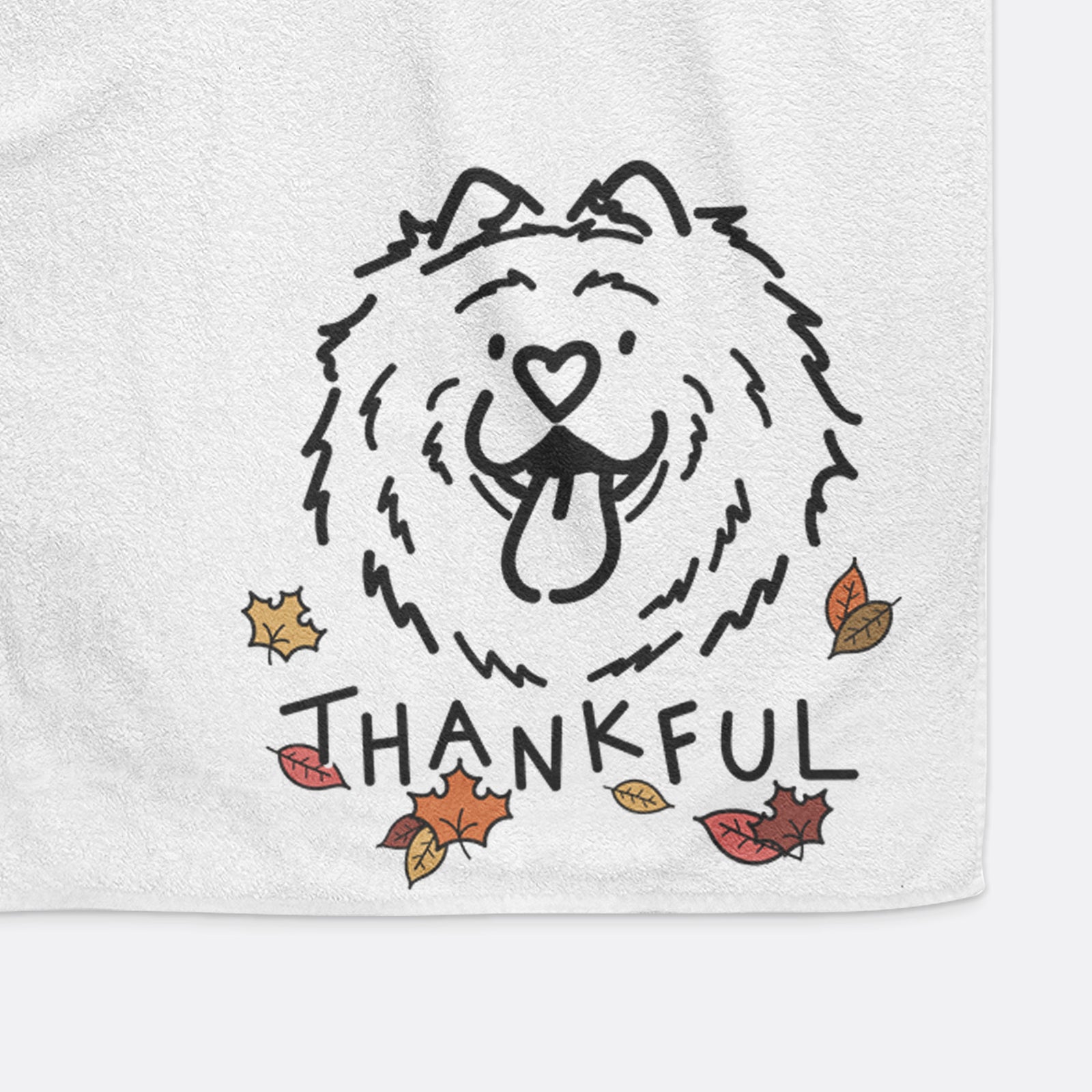 Minimalist line drawing of Bear the Chow Chow with 'Thankful' lettering on a hand towel