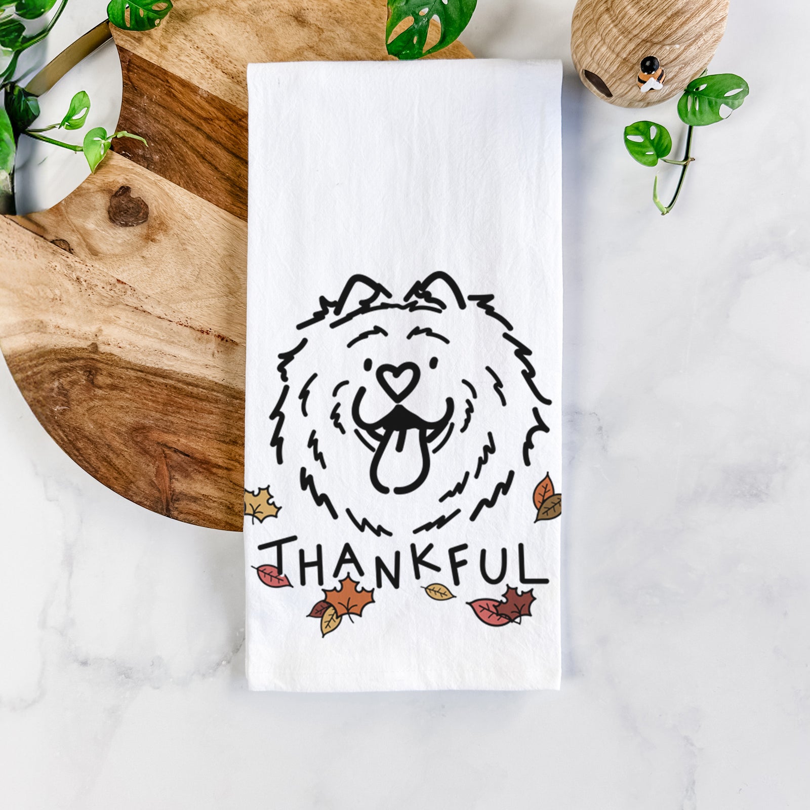 Minimalist line drawing of Bear the Chow Chow with 'Thankful' lettering on a tea towel