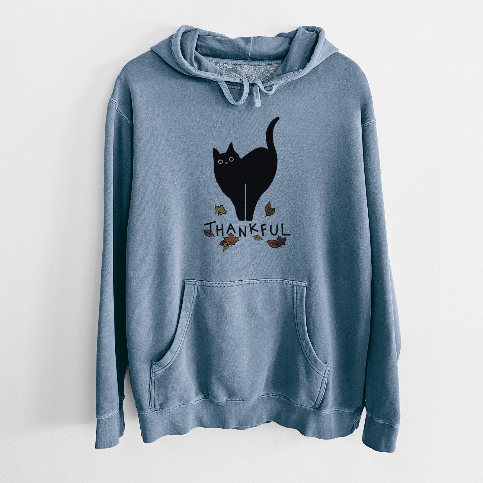 Minimalist line drawing of Bella the Black Cat with 'Thankful' lettering on a Slate Blue Unisex pigment dyed hoodie