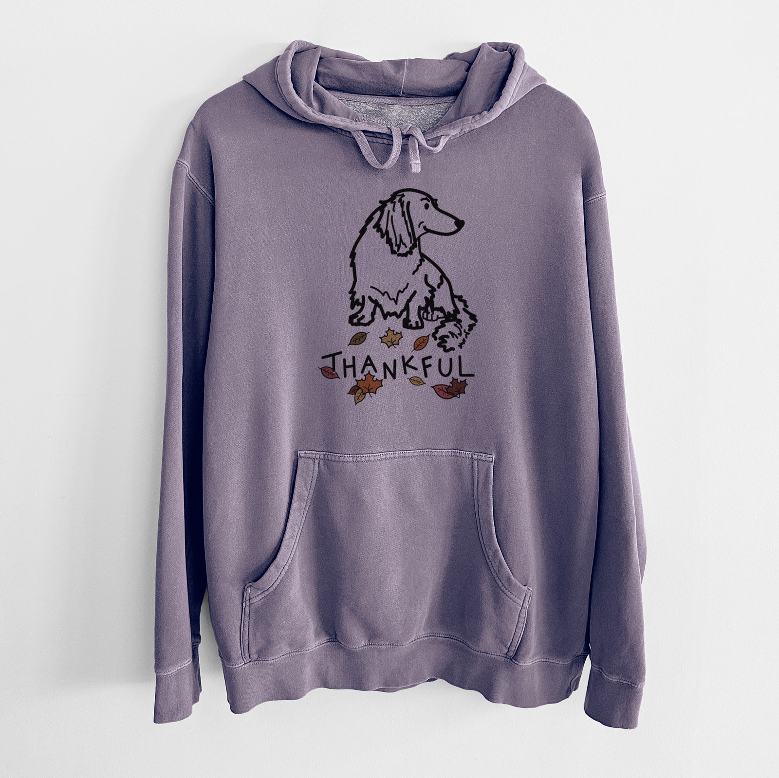 Minimalist line drawing of Bella the Dachshund with 'Thankful' lettering on a Plum Unisex pigment dyed hoodie