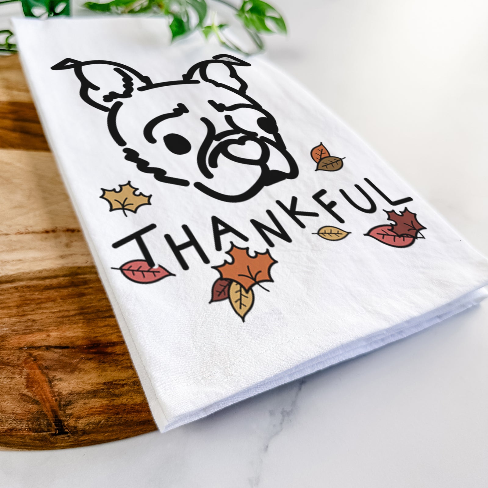 Minimalist line drawing of Bella the Pug Boston Terrier Mix with 'Thankful' lettering on a tea towel