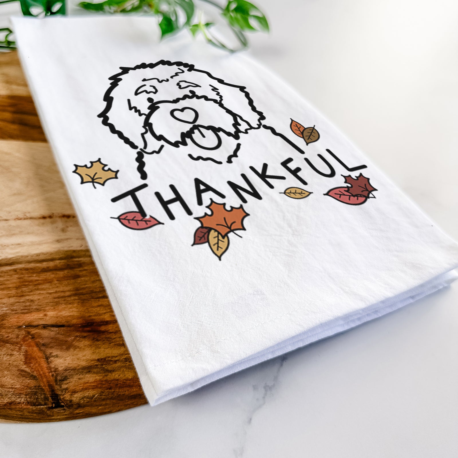 Minimalist line drawing of a Bernedoodle with 'Thankful' lettering on a tea towel