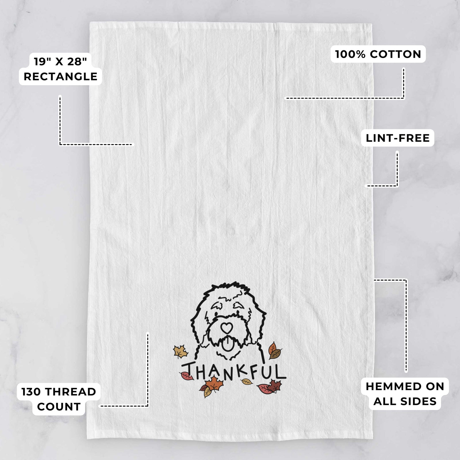 Minimalist line drawing of a Bernedoodle with 'Thankful' lettering on a tea towel, with feature callouts: 19 x 28 inch rectangle, 100% cotton, lint-free, 120 thread count, hemmed on all sides