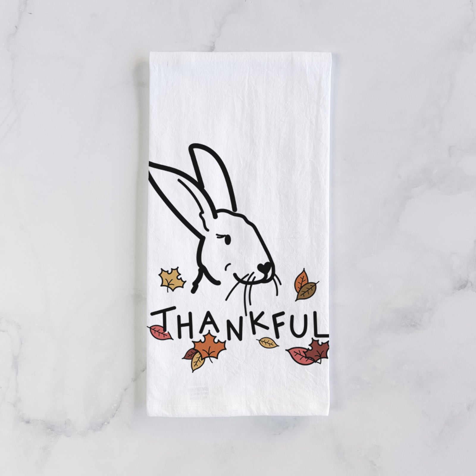 Minimalist line drawing of Betsy the Rex Rabbit with 'Thankful' lettering on a tea towel