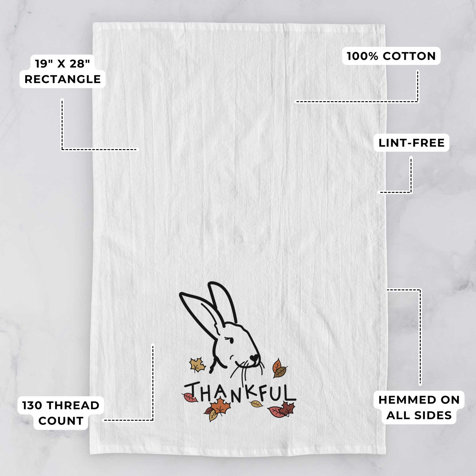 Minimalist line drawing of Betsy the Rex Rabbit with 'Thankful' lettering on a tea towel, with feature callouts: 19 x 28 inch rectangle, 100% cotton, lint-free, 120 thread count, hemmed on all sides