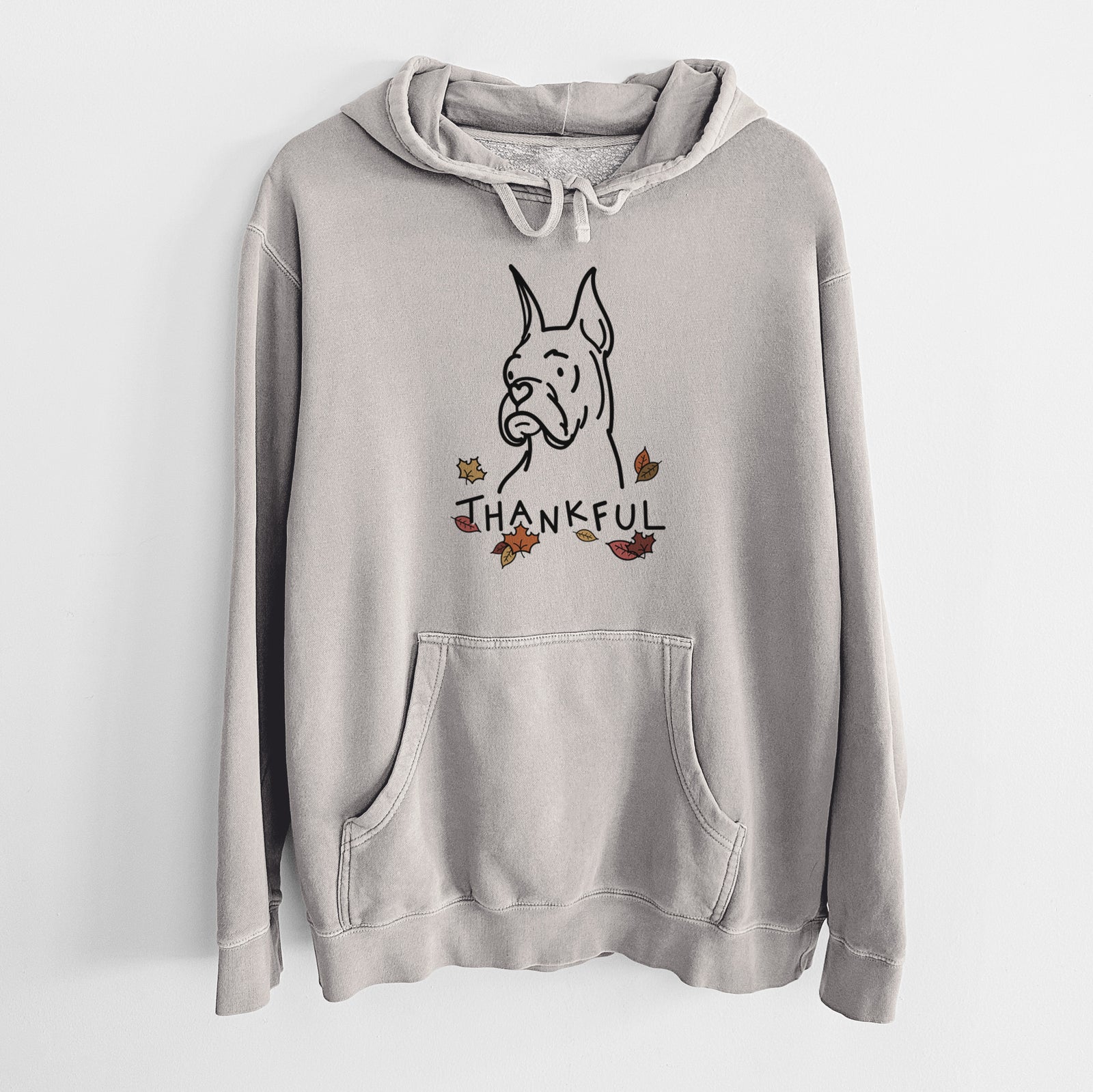 Minimalist line drawing of Billy the Rescue Boxer with 'Thankful' lettering on a Cement Unisex pigment dyed hoodie