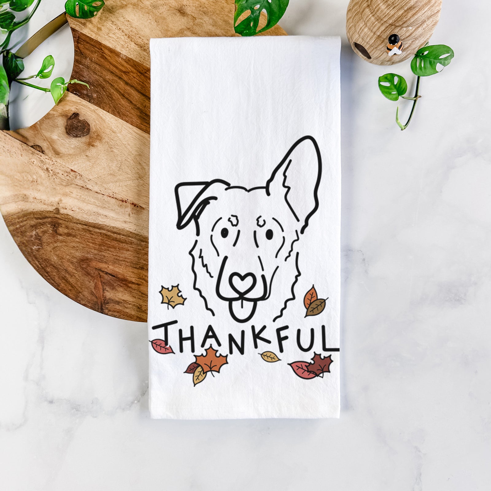 Minimalist line drawing of Bodhi the Shepherd Mix with 'Thankful' lettering on a tea towel