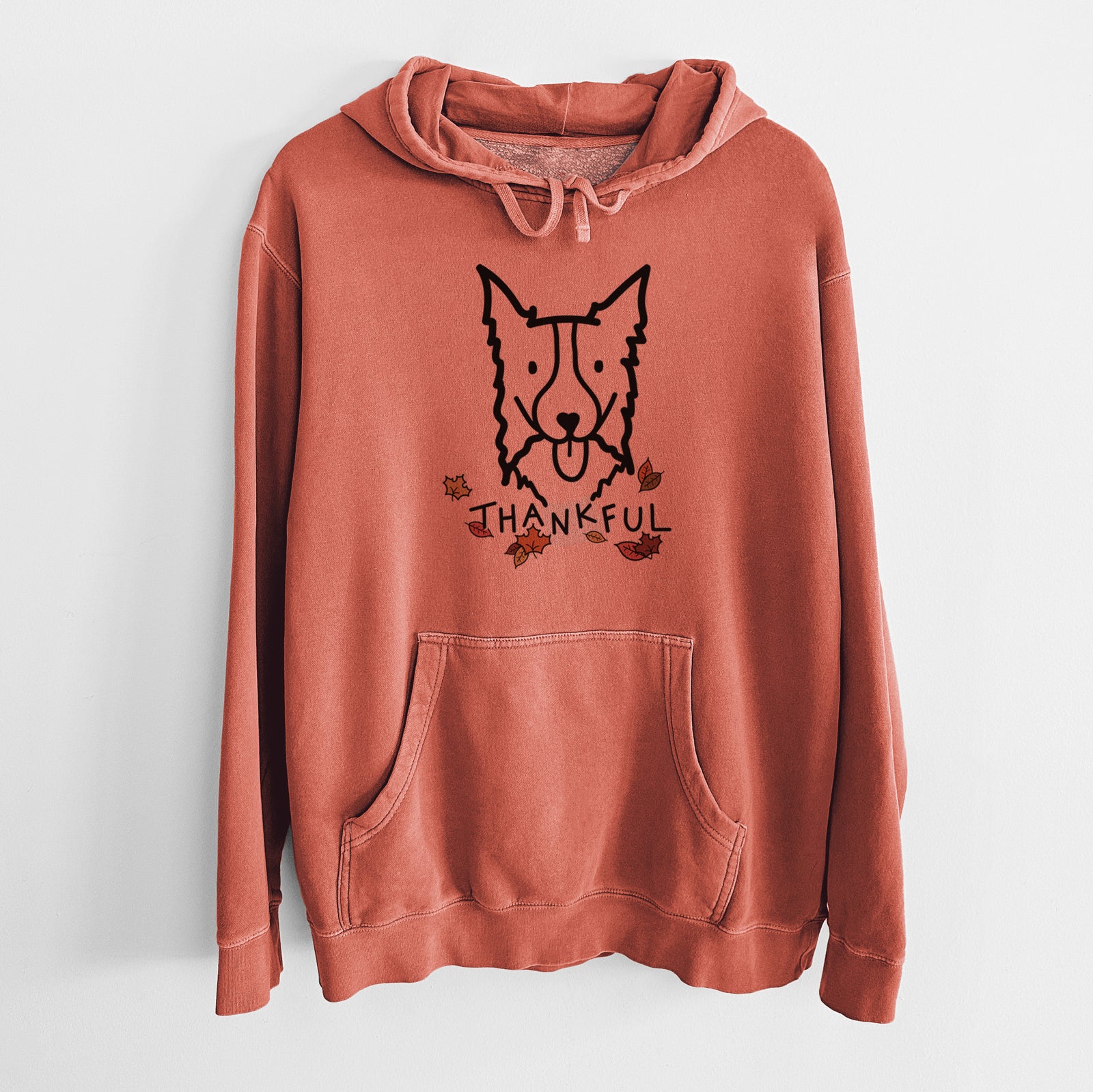 Minimalist line drawing of a Border Collie with 'Thankful' lettering on an Amber Unisex pigment dyed hoodie