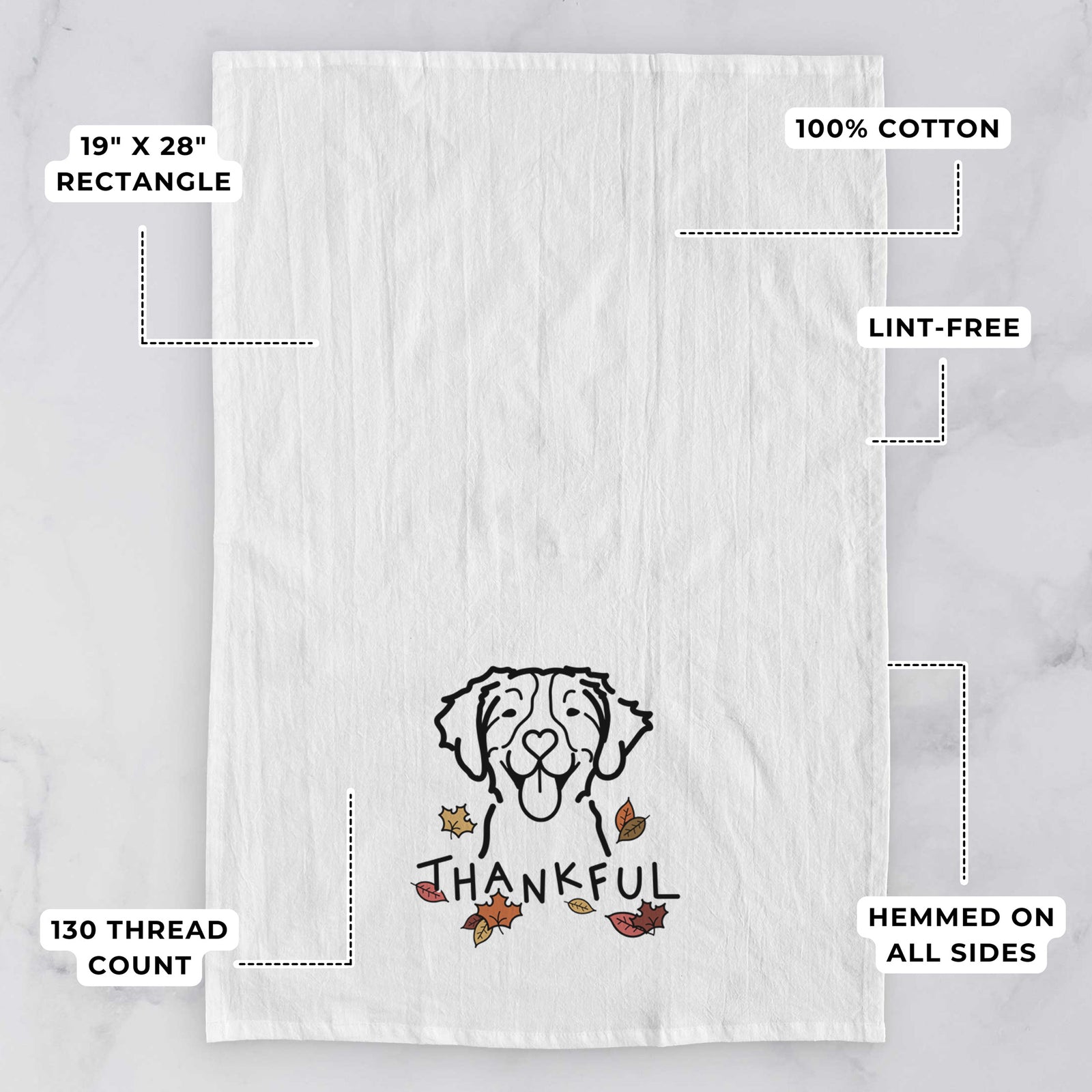 Minimalist line drawing of a Brittany with 'Thankful' lettering on a tea towel, with feature callouts: 19 x 28 inch rectangle, 100% cotton, lint-free, 120 thread count, hemmed on all sides