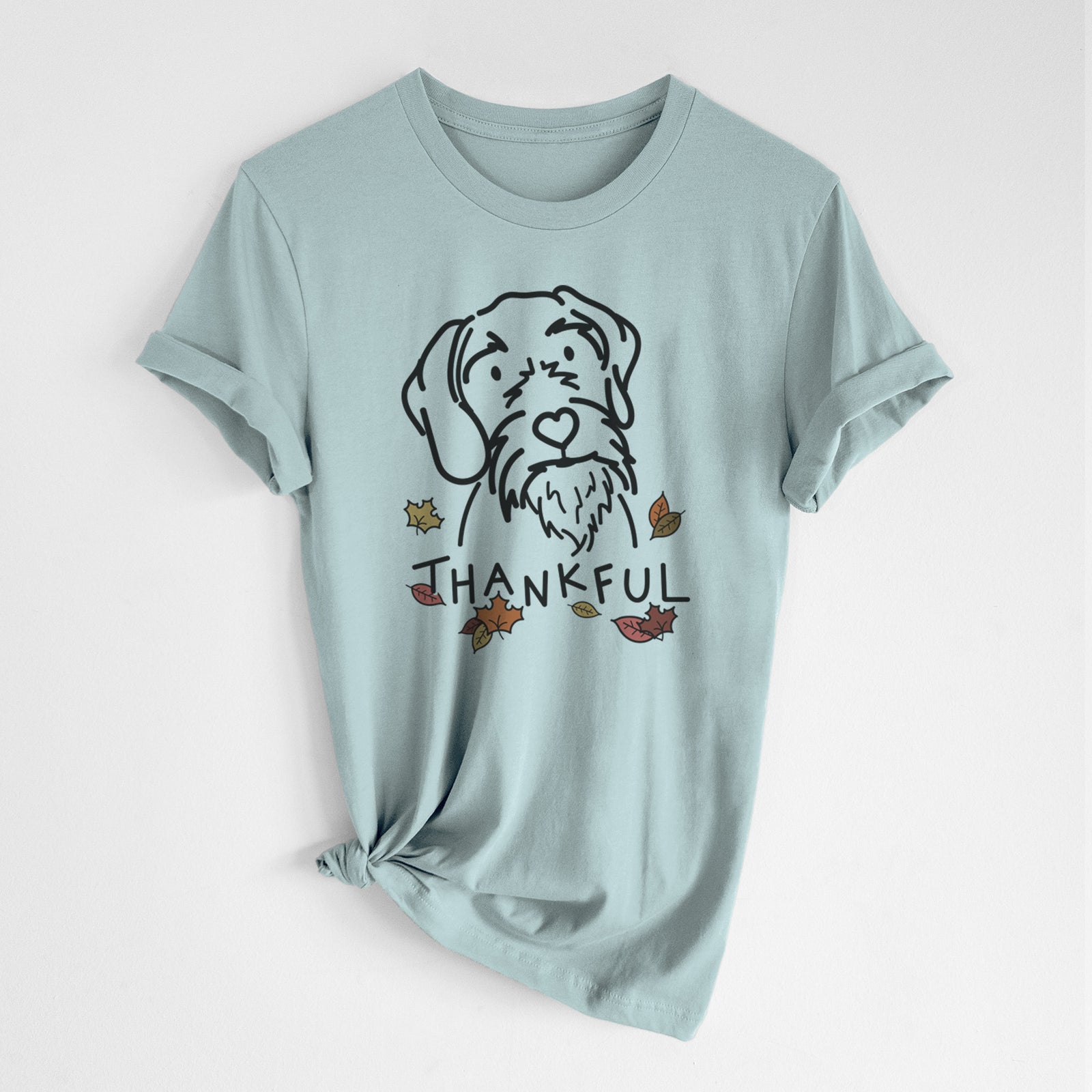 Minimalist line drawing of Buck the German Wirehaired Pointer with 'Thankful' lettering on a Dusty Blue Unisex crewneck, worn by a woman