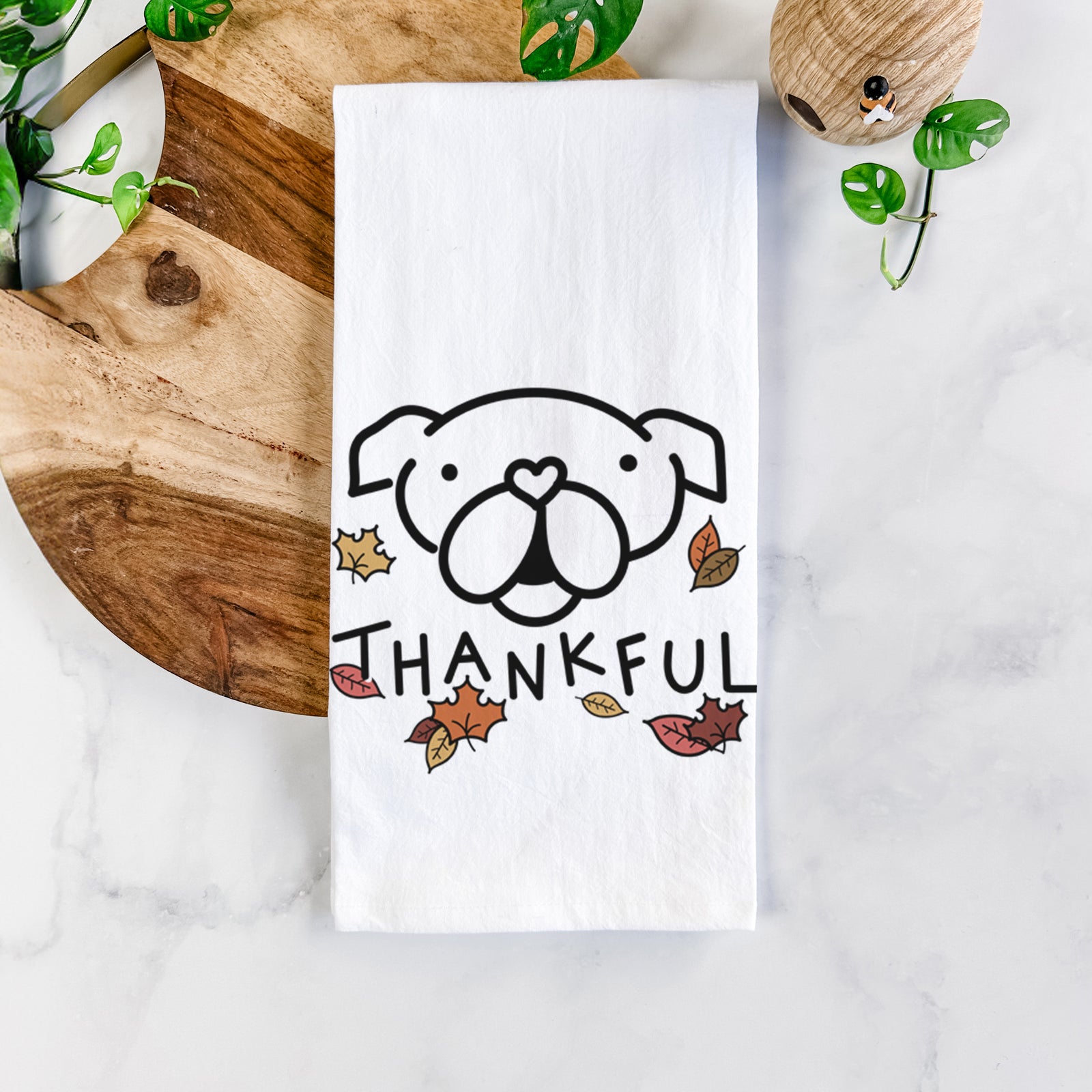 Minimalist line drawing of an English Bulldog with 'Thankful' lettering on a tea towel