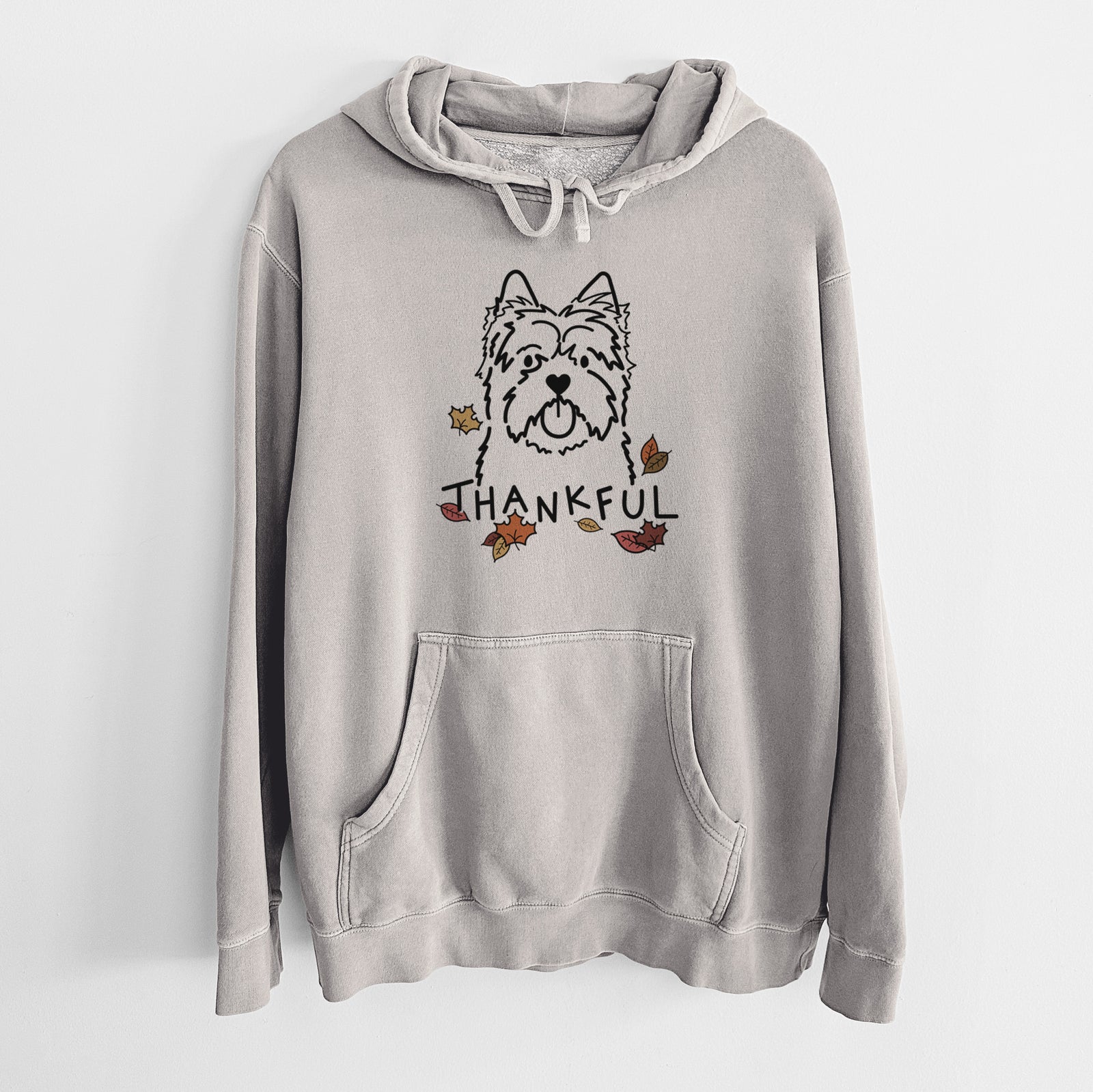 Minimalist line drawing of a Cairn Terrier with 'Thankful' lettering on a Cement Unisex pigment dyed hoodie