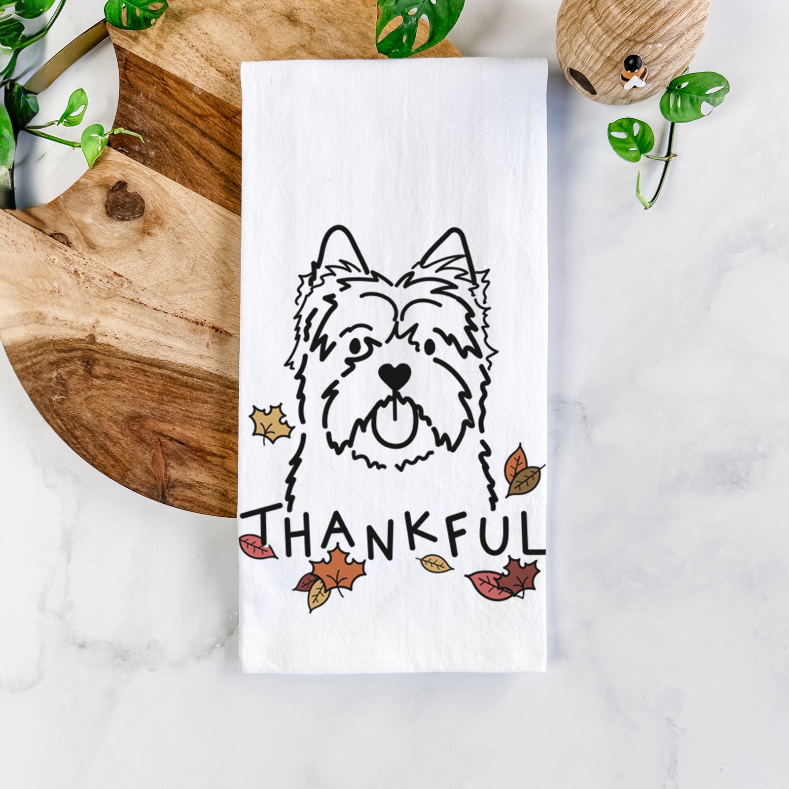 Minimalist line drawing of a Cairn Terrier with 'Thankful' lettering on a tea towel
