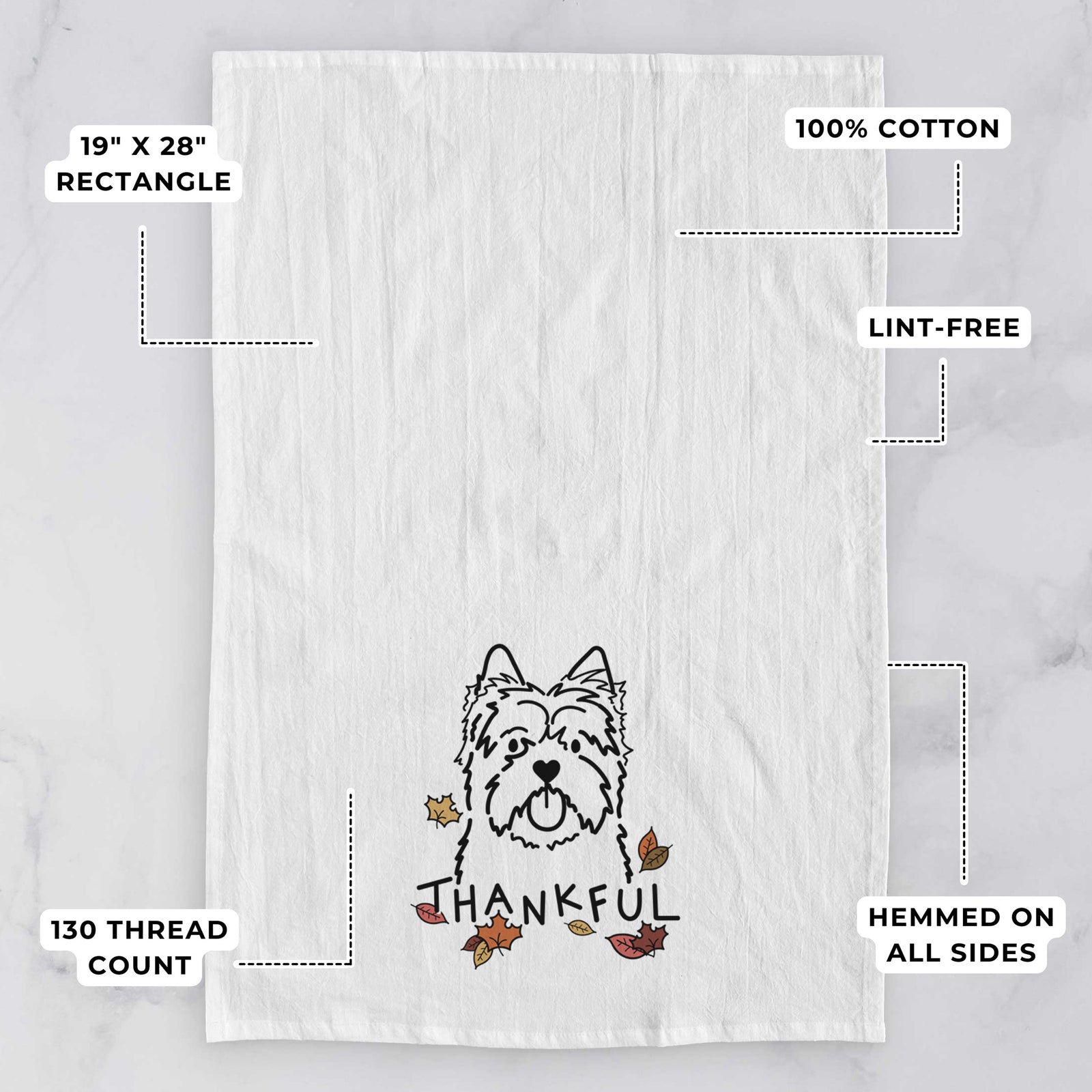 Minimalist line drawing of a Cairn Terrier with 'Thankful' lettering on a tea towel, with feature callouts: 19 x 28 inch rectangle, 100% cotton, lint-free, 120 thread count, hemmed on all sides