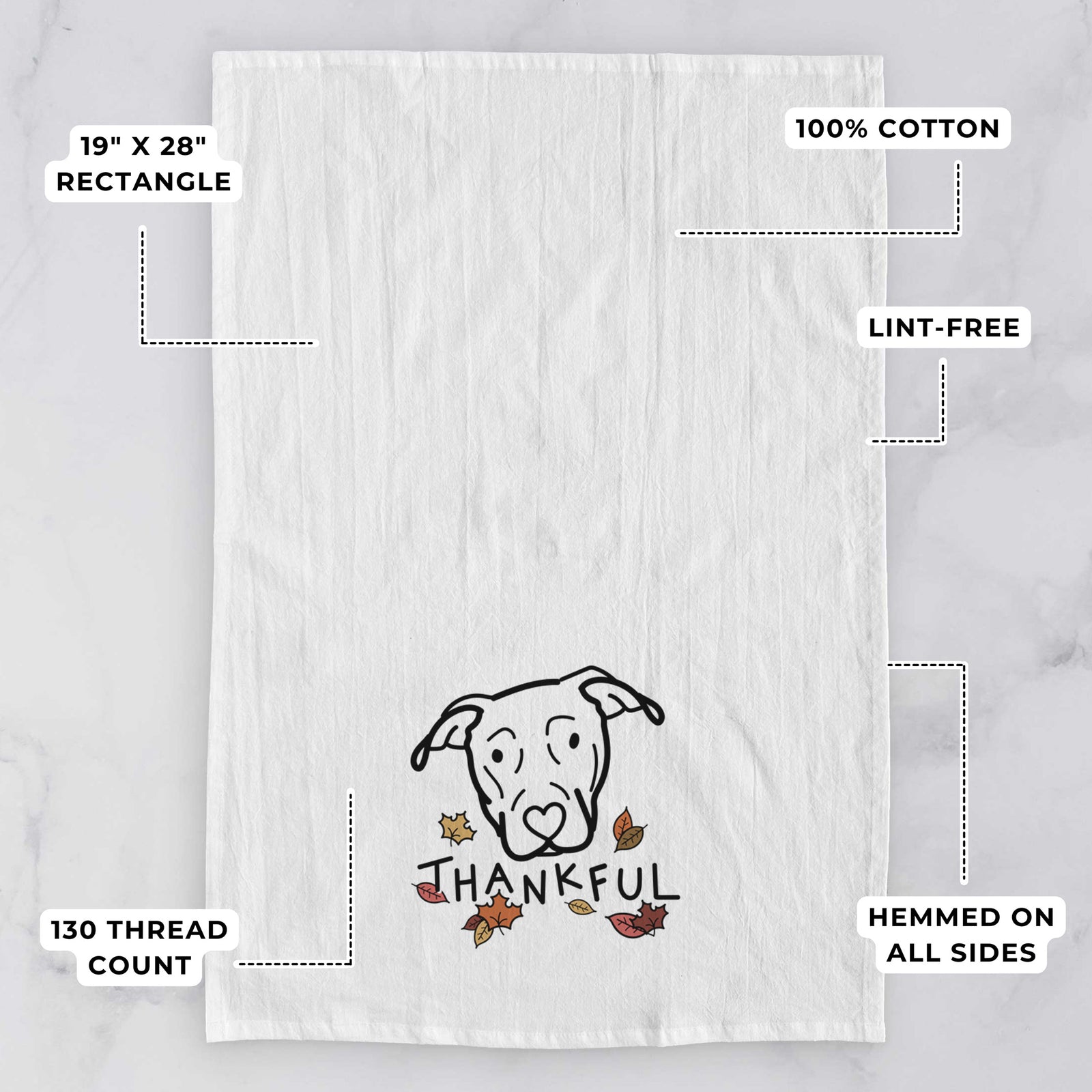 Minimalist line drawing of a Catahoula with 'Thankful' lettering on a tea towel, with feature callouts: 19 x 28 inch rectangle, 100% cotton, lint-free, 120 thread count, hemmed on all sides